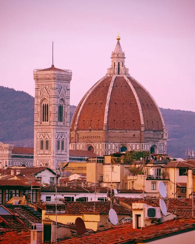 A purple sunset view of the duomo in Florence, Italy