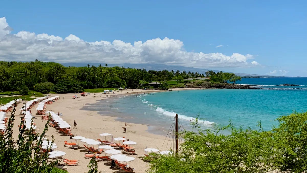 One of the best beaches on the Big Island, with lounge chairs, umbrellas and white sand.