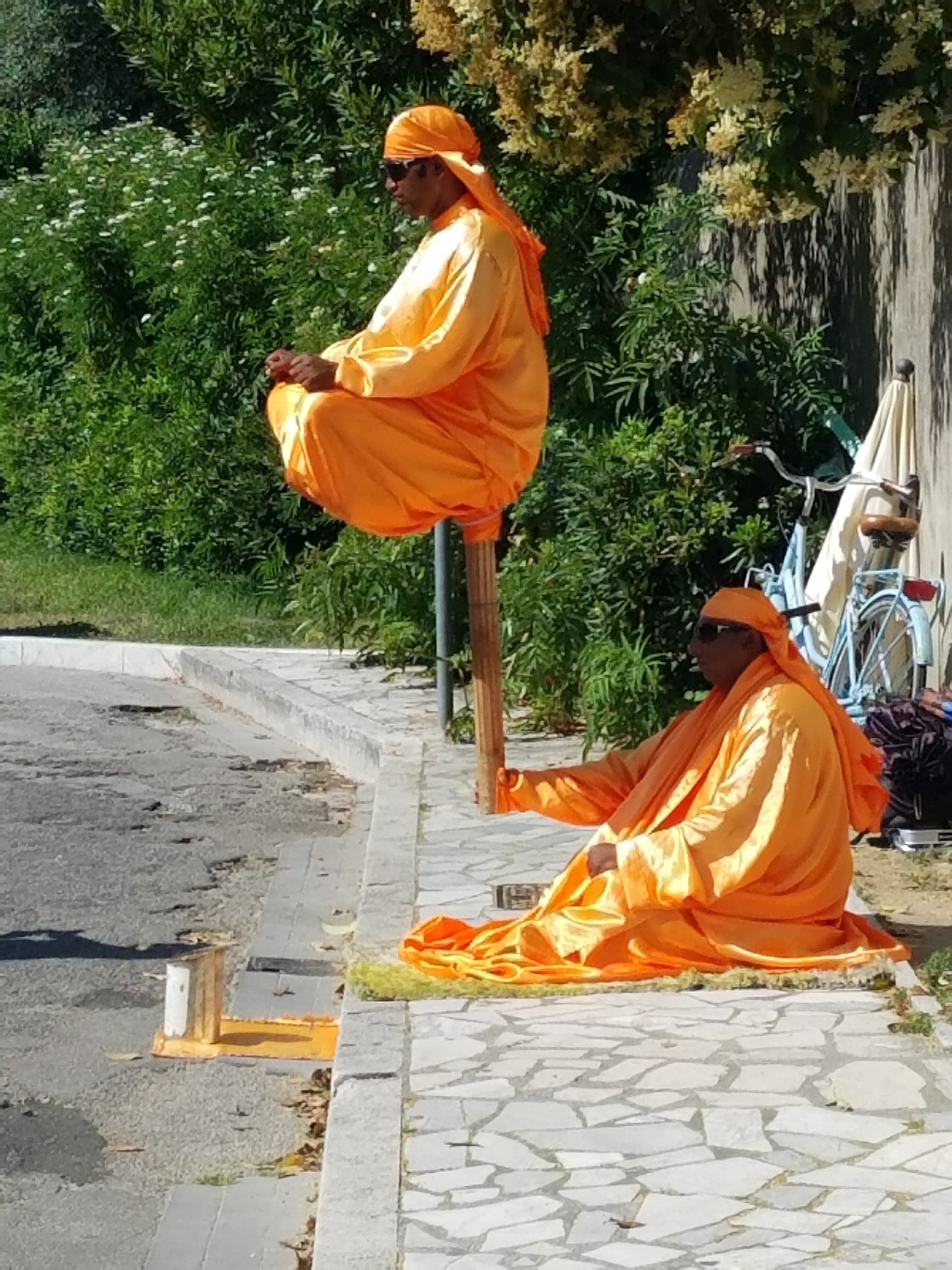 Picture of pandits sitting on footpath