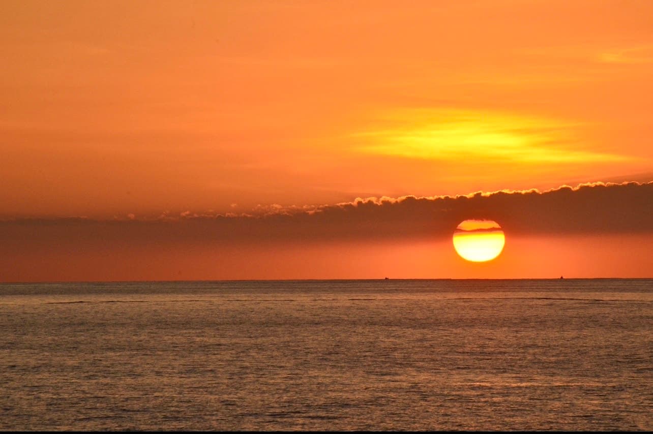 Sunset shedding yellow light on the sea