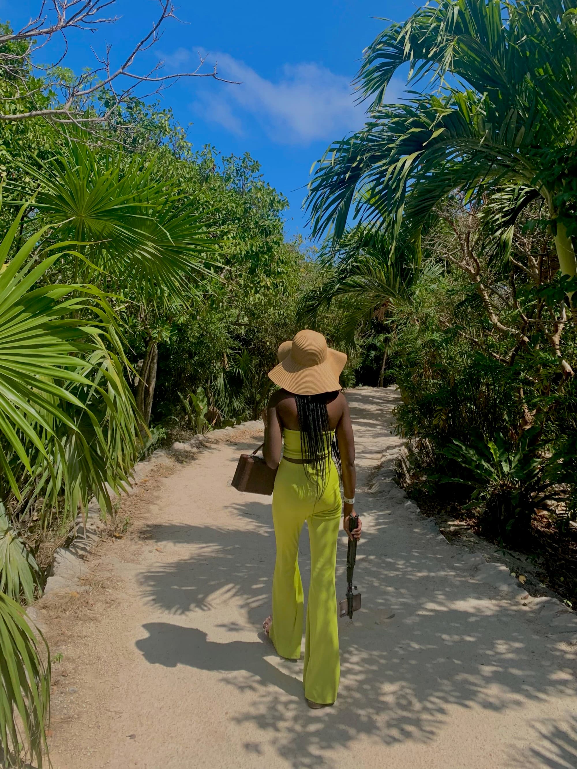 Travel advisor in neon green top and pants.