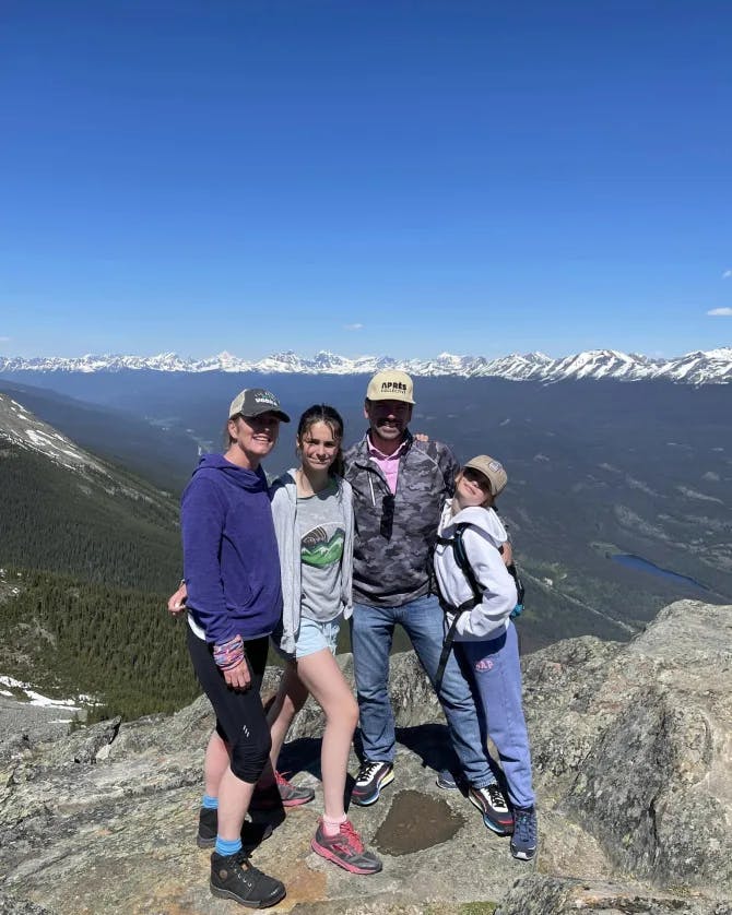 Family photo on top of a mountain