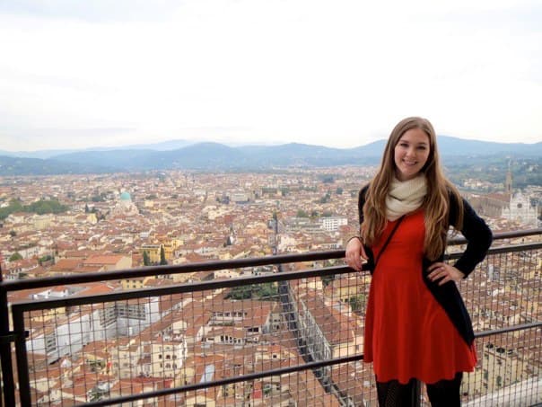 Picture of Nicole wearing red dress and black jacket
