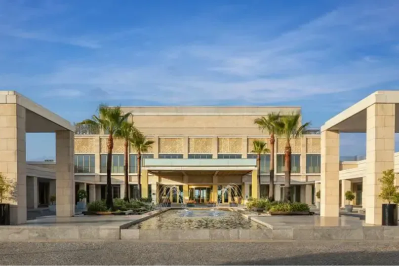 Sharp stone architecture, manicured palms and an elegant fountain welcome guests to the Anantara Vilamoura Algarve Resort