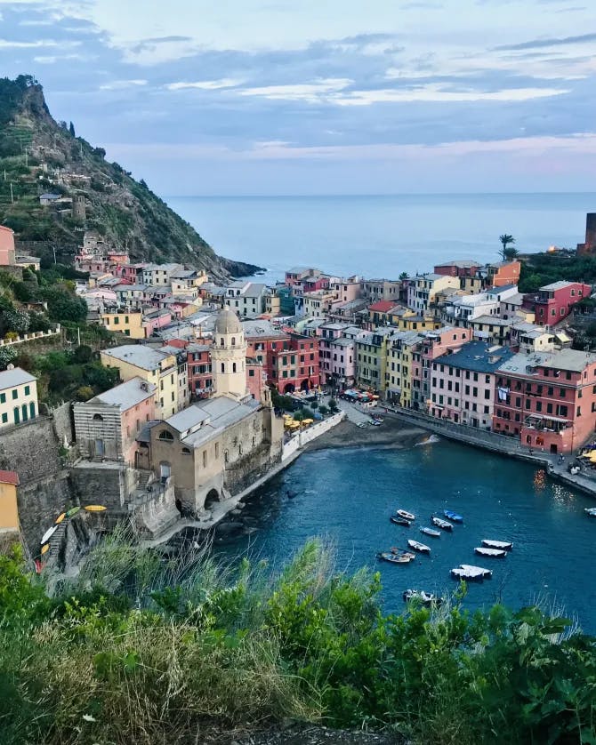 An aerial view of Cinque Terre with the sea and mountain in the background