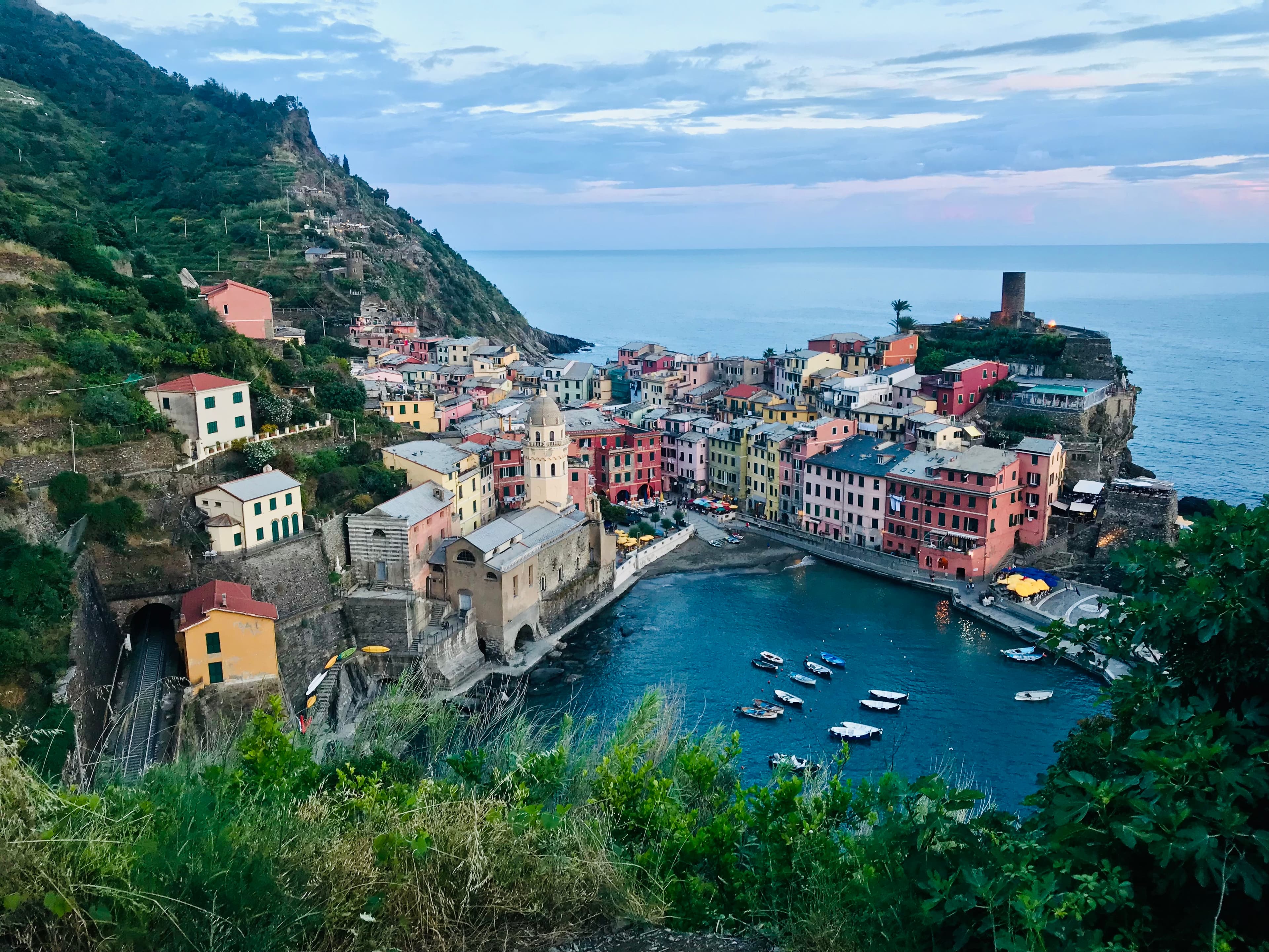 An aerial view of Cinque Terre with the sea and mountain in the background