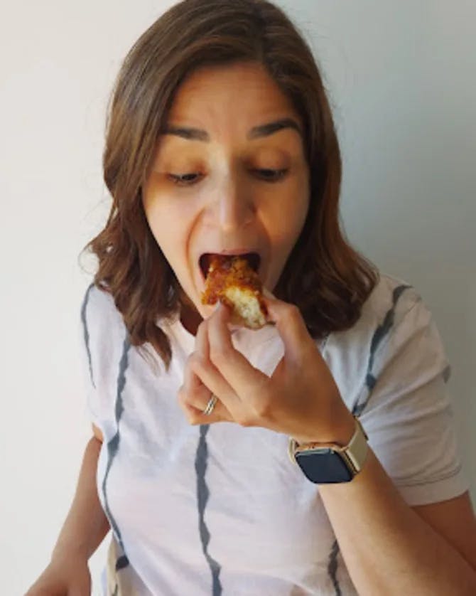 Girl eating pastry. 