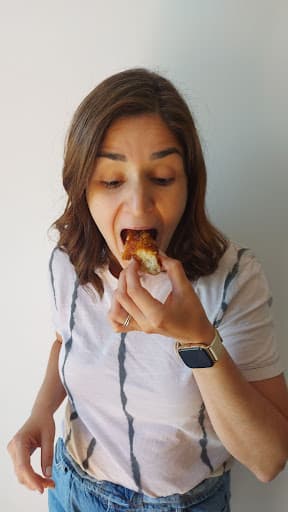 Girl eating pastry.