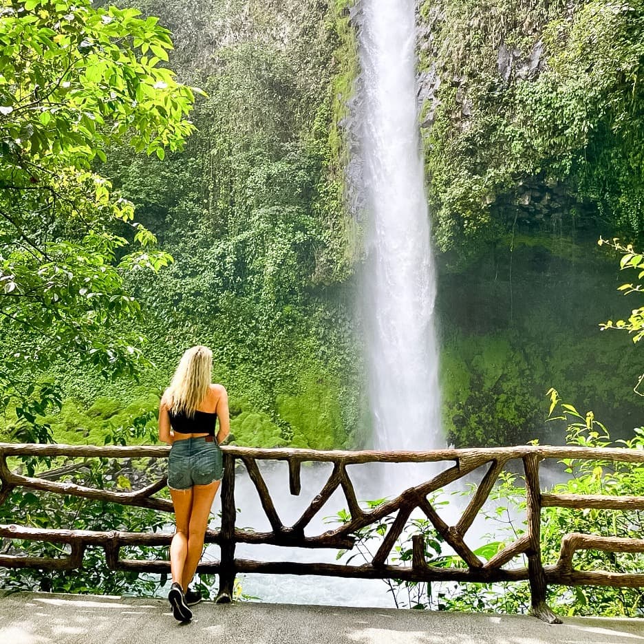 Summer posing in front of a waterfall