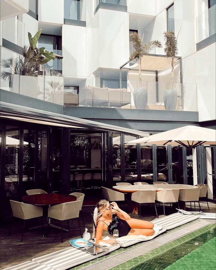 A woman posing on the floor of restaurant