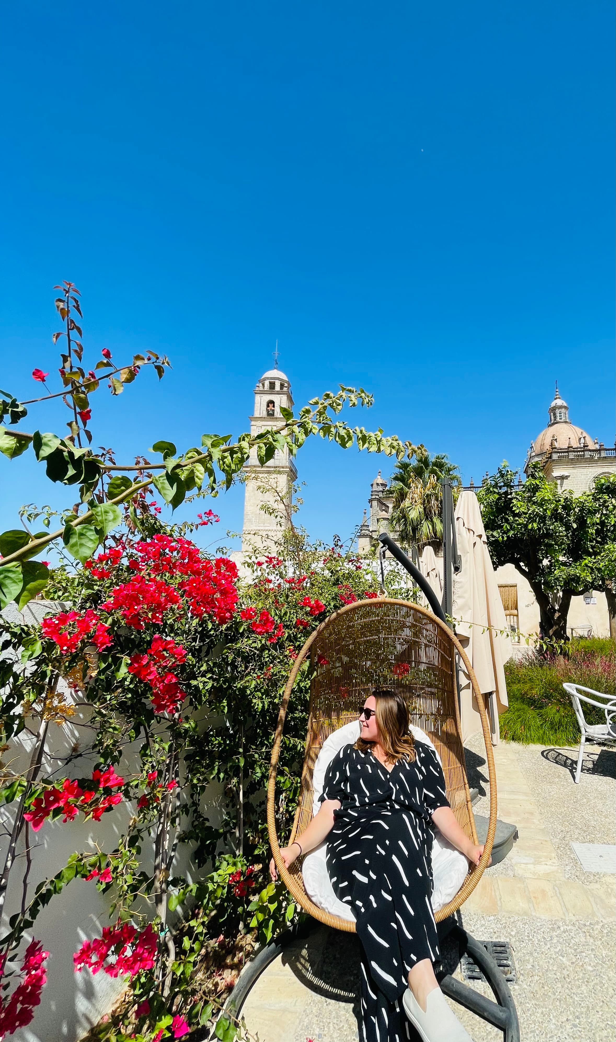 Nataliya Gowan travel advisor on a swing couch.