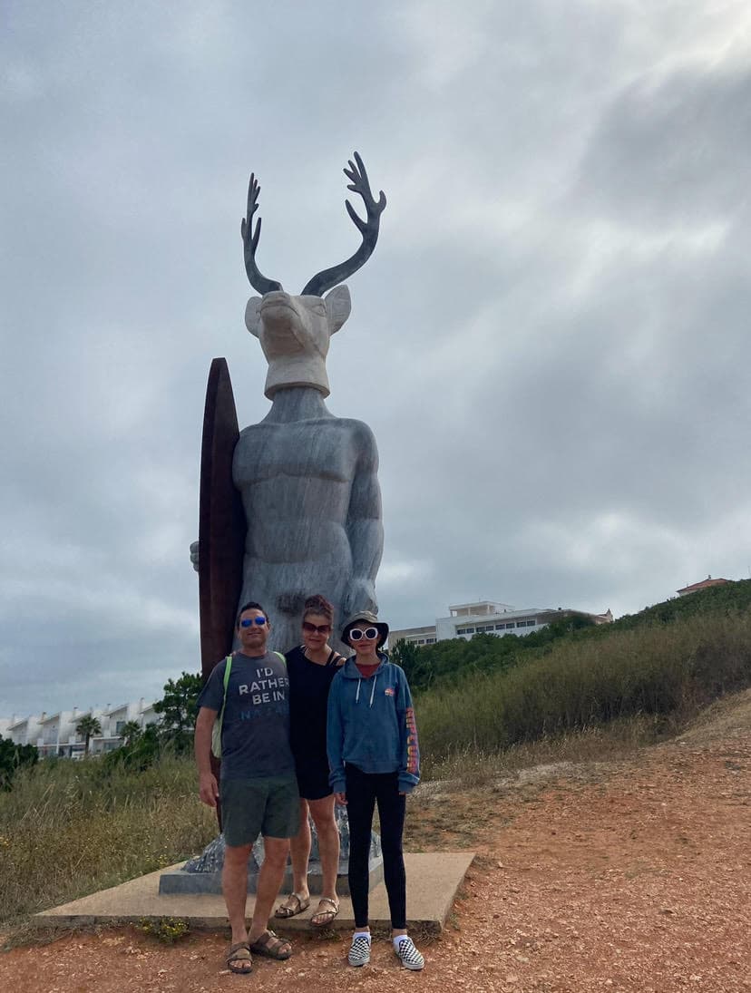 Picture of Stephanie with statue along friends