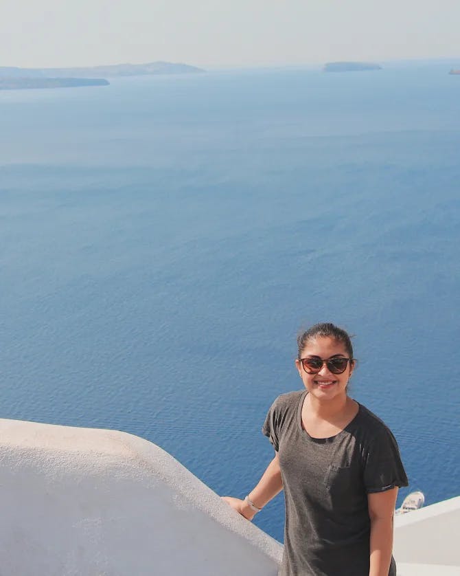 Picture of Amber in front of a sea view in Greece