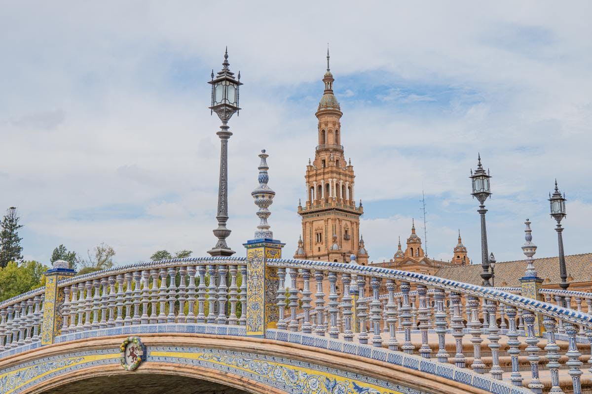 Bridge and historic buildings of Plaza de Espana in Seville, Spain.