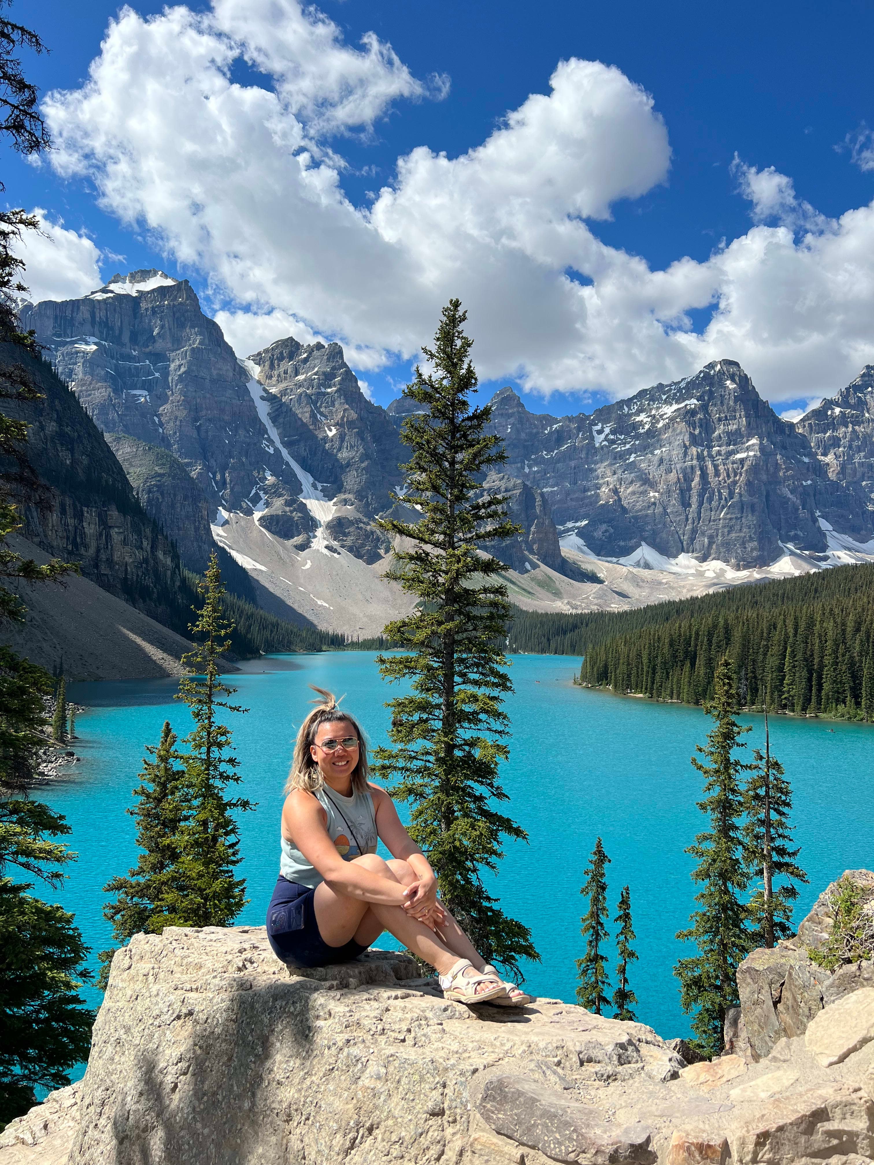 Posing for a photo by the lake