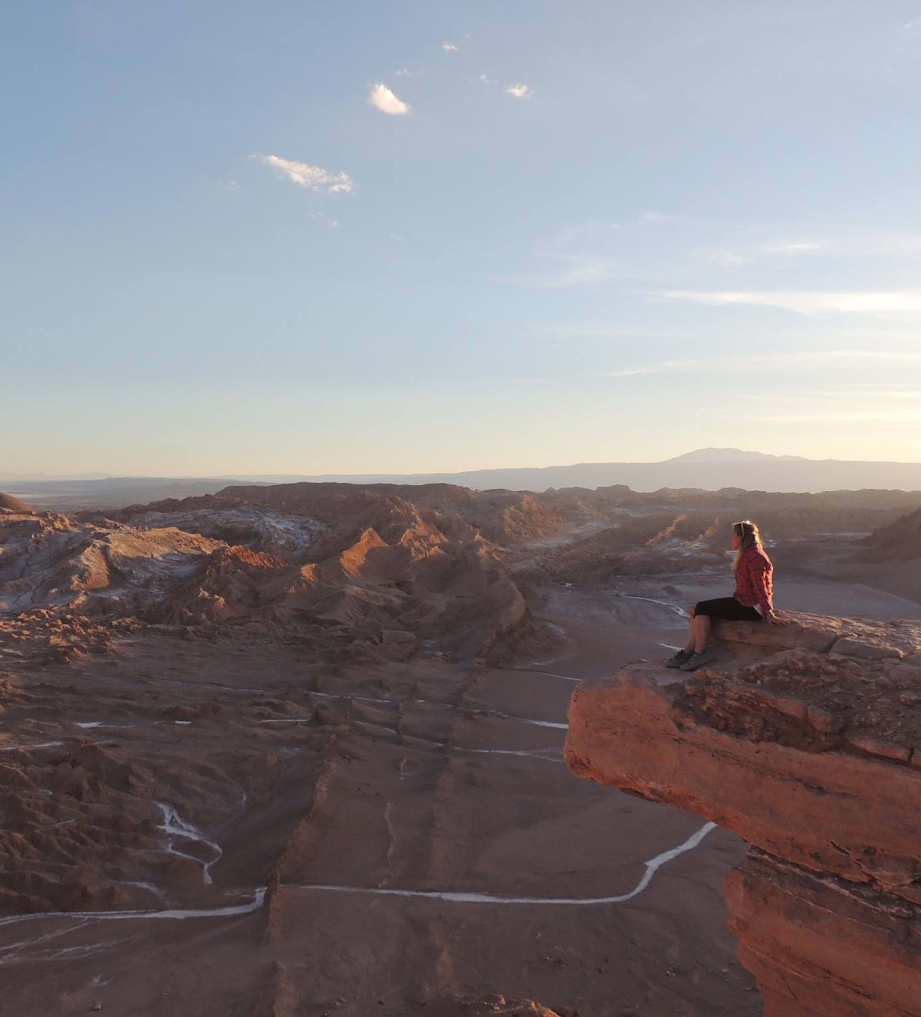 Picture of Laurel sitting on edge of a mountain