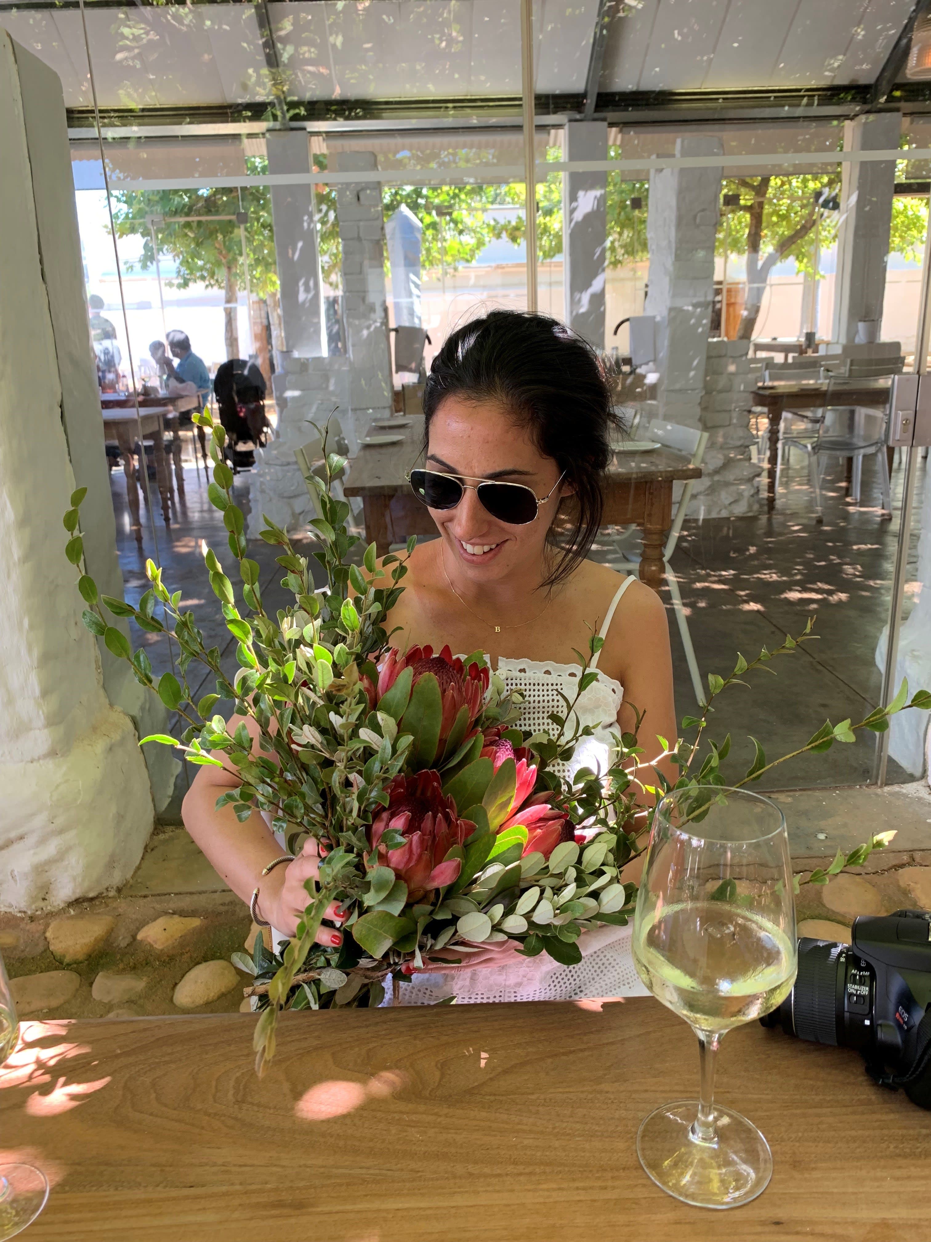 Holding a bouquet of flowers