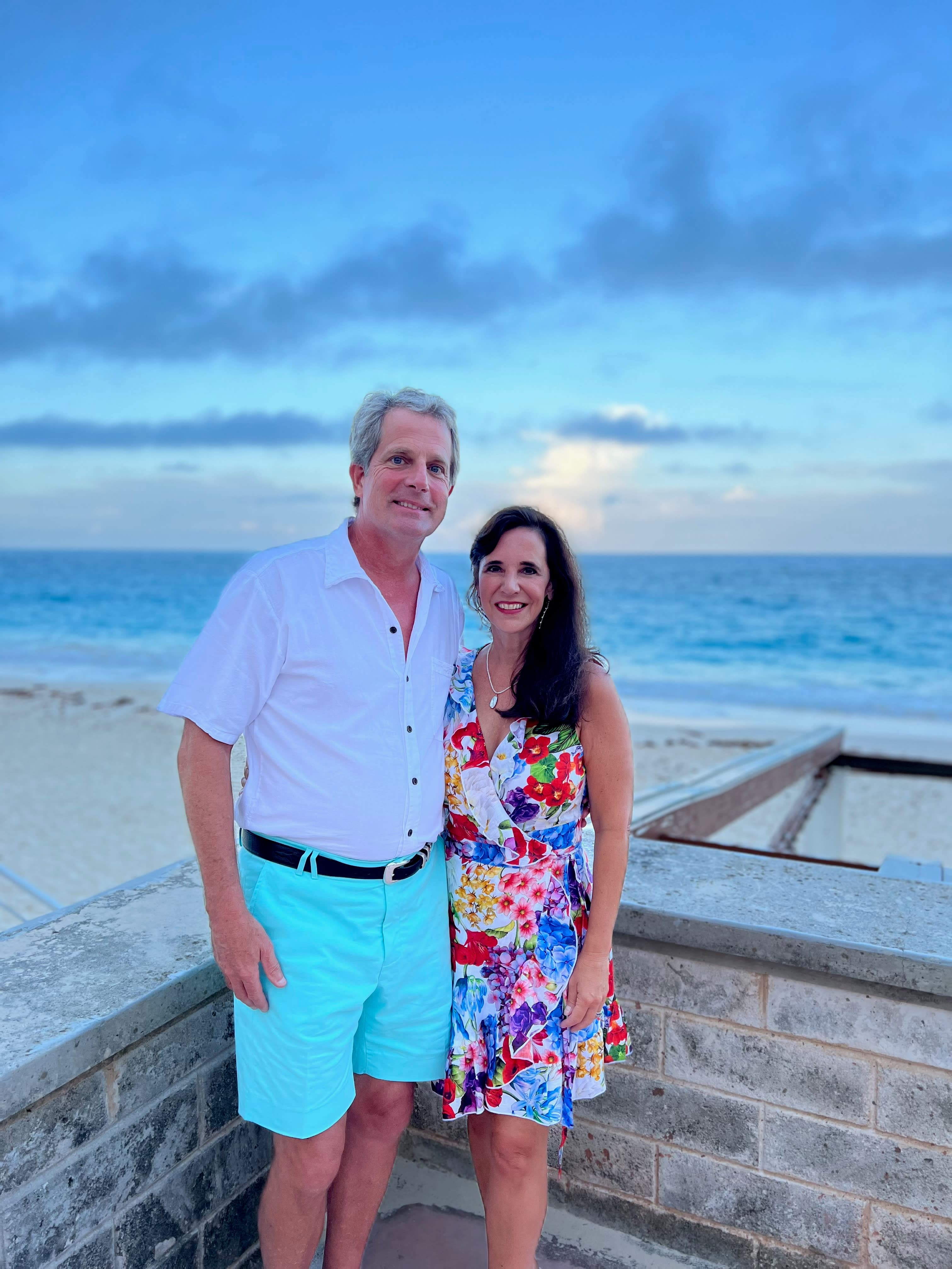 Posing for a couple photo with the view of the beach in the background
