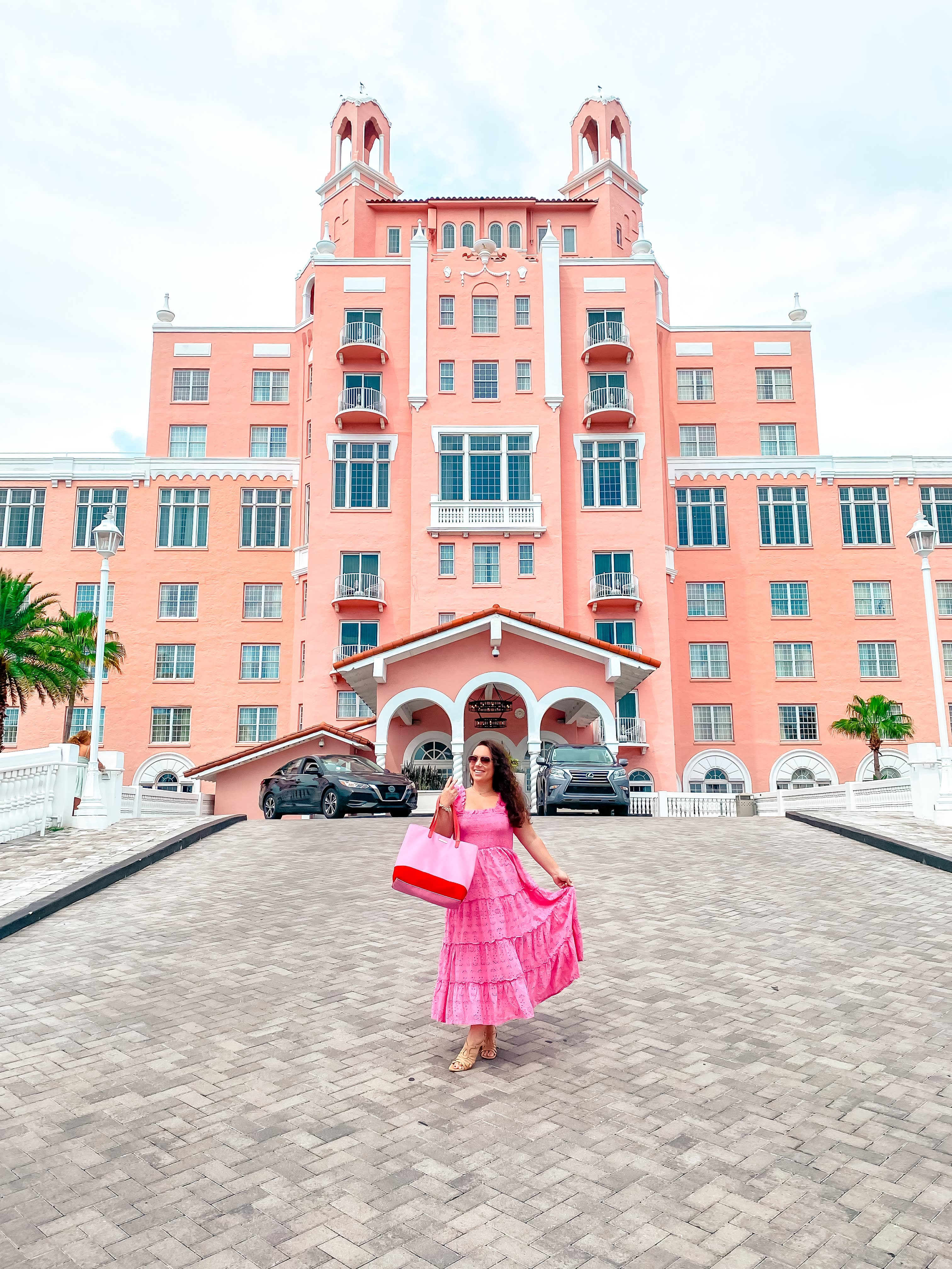 Posing for a photo in a pink dress standing in the driveway