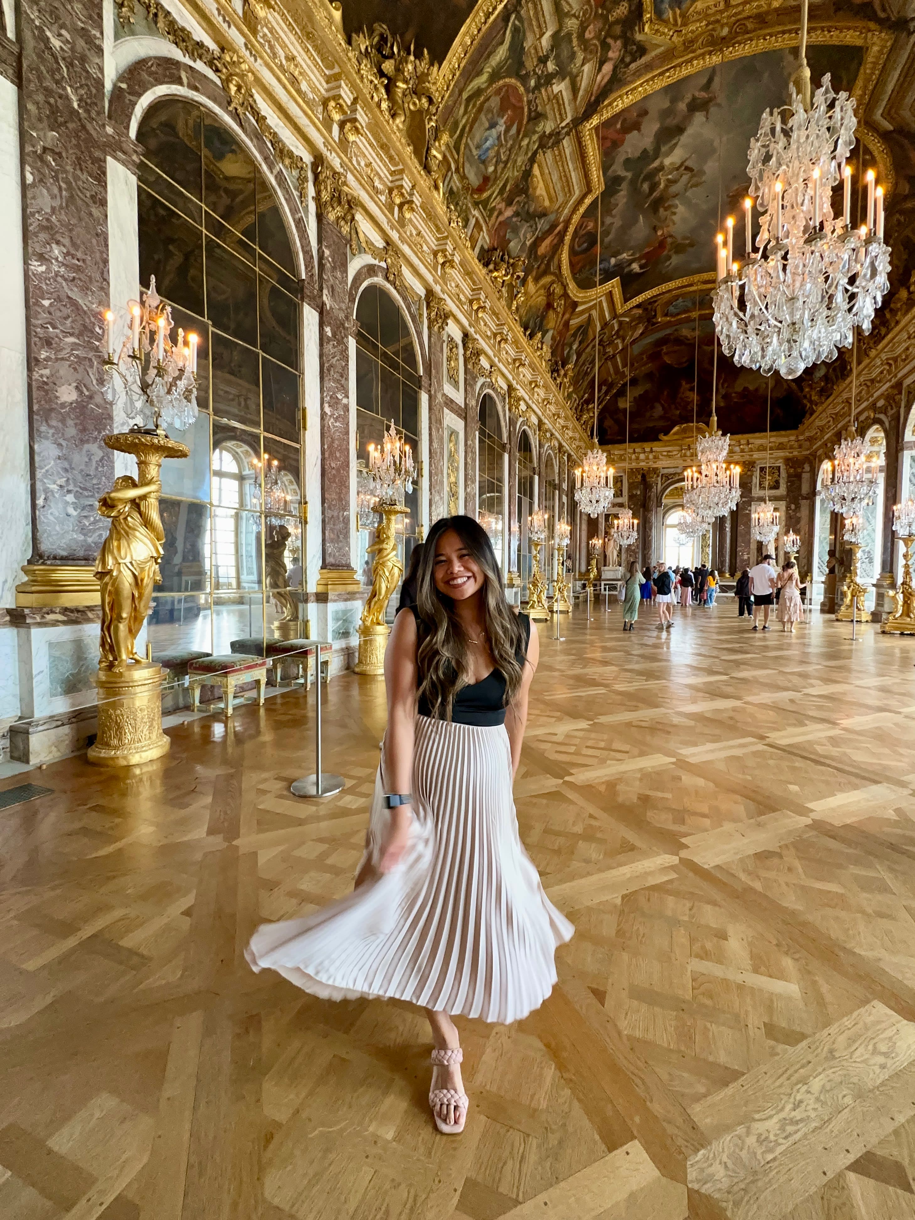 Posing for a photo in the Hall of Mirrors