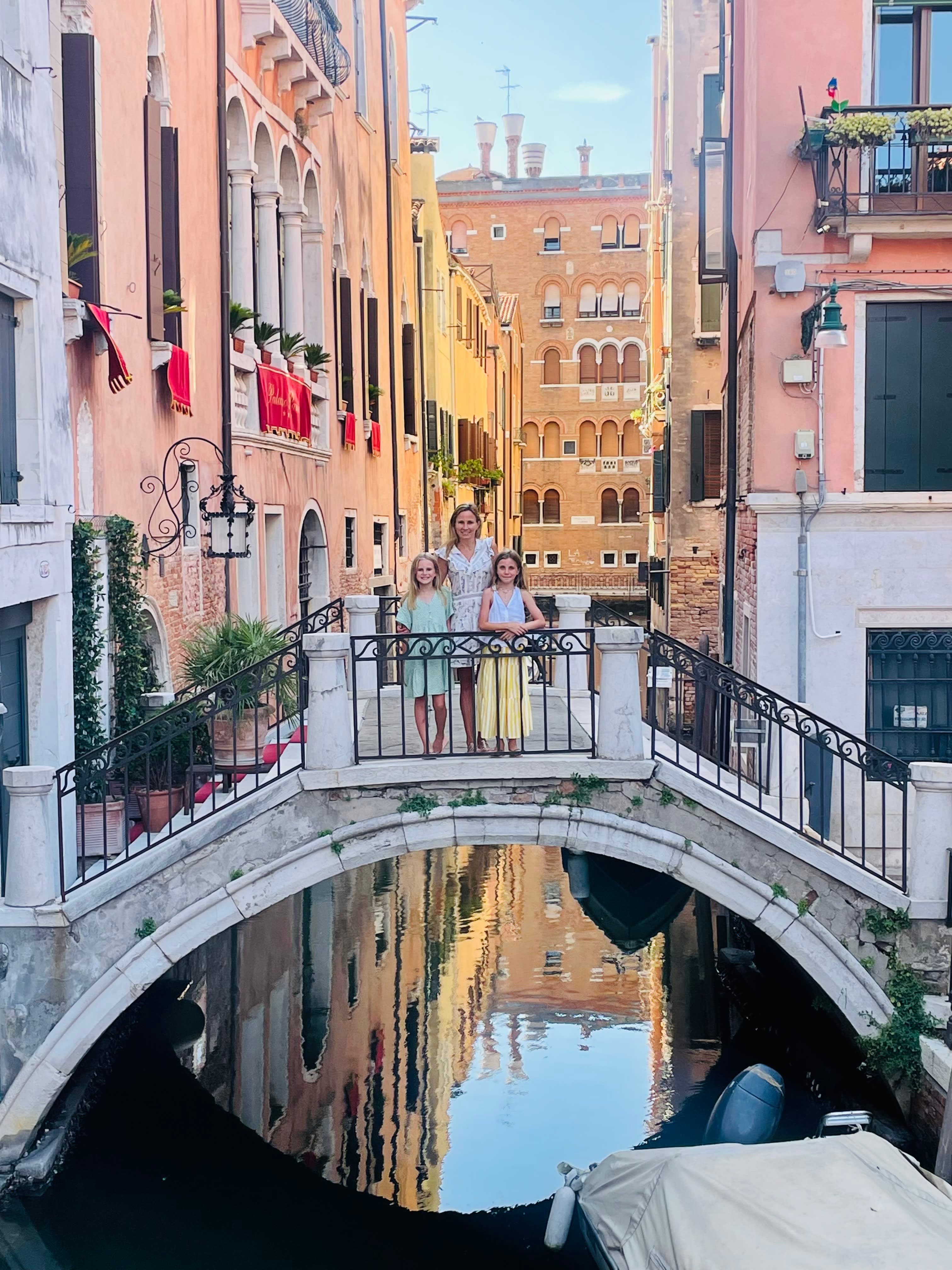Picture of Abby with kids on bridge in Venice