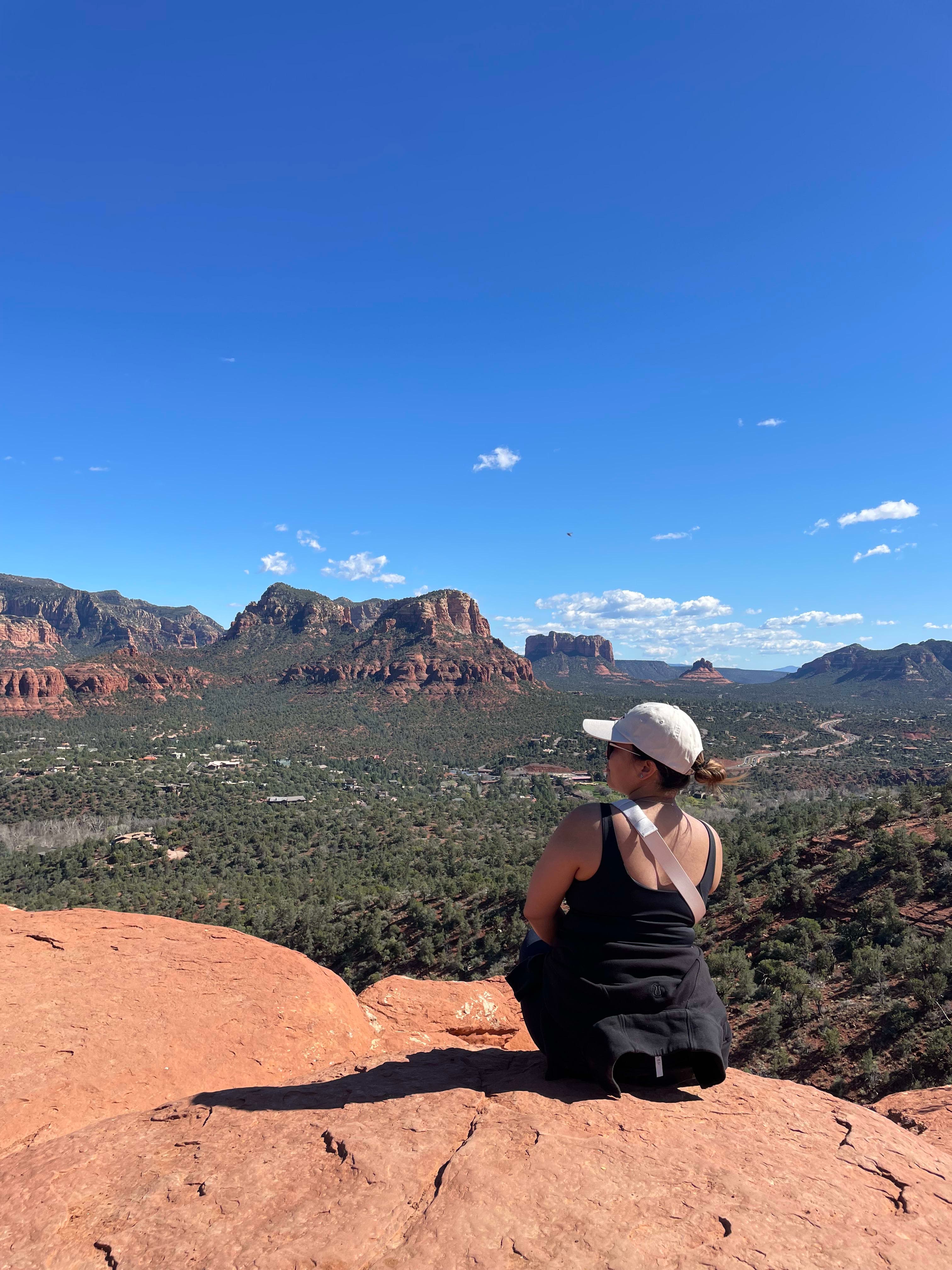 Sitting on the edge of a cliff looking at the beautiful view