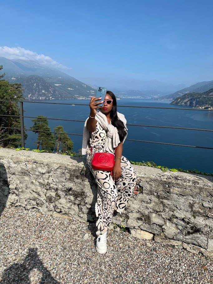 Taking a selfie with the beautiful view of the mountains and the sea