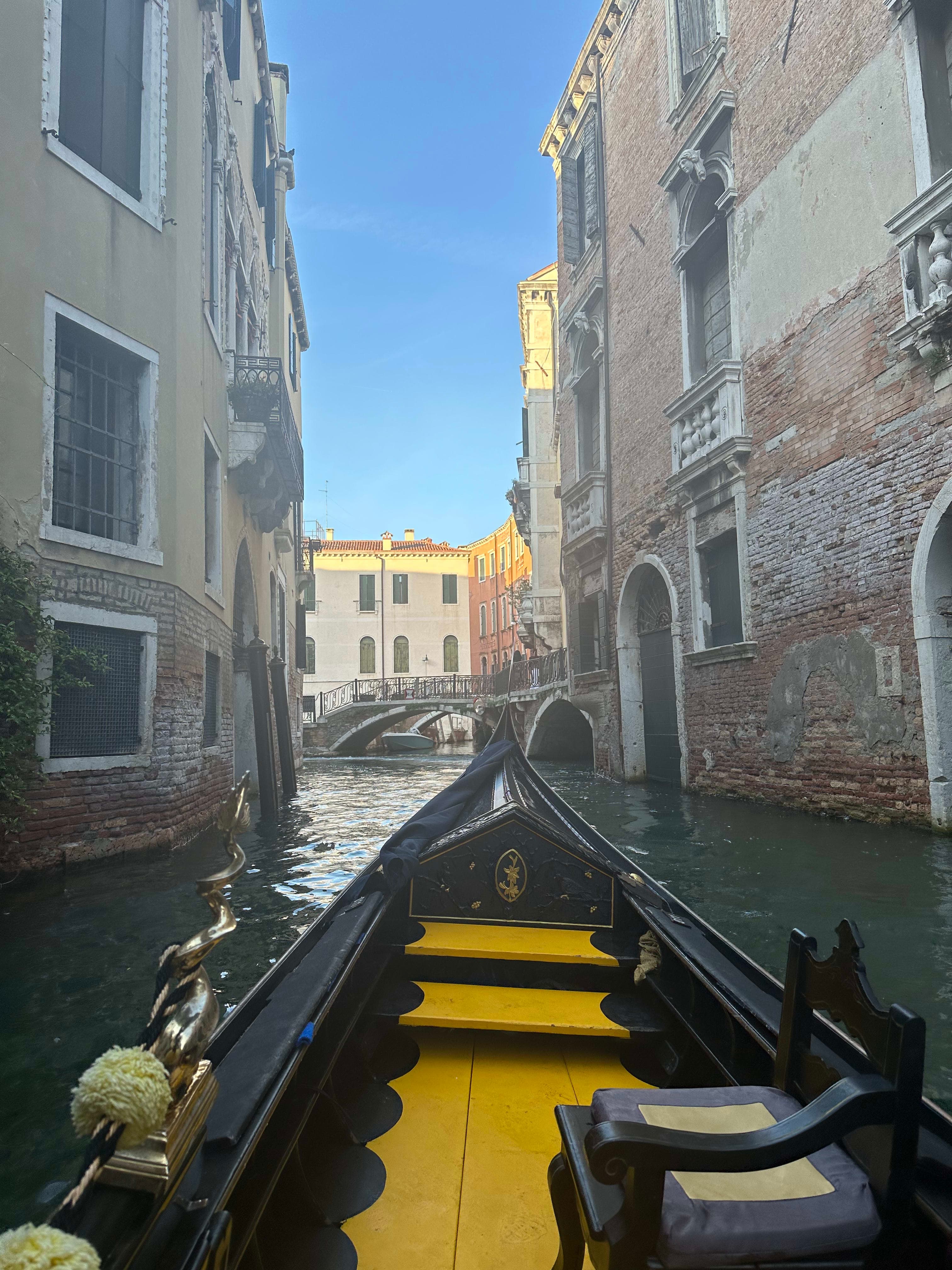 Taking a boat ride in a narrow Venetian canal