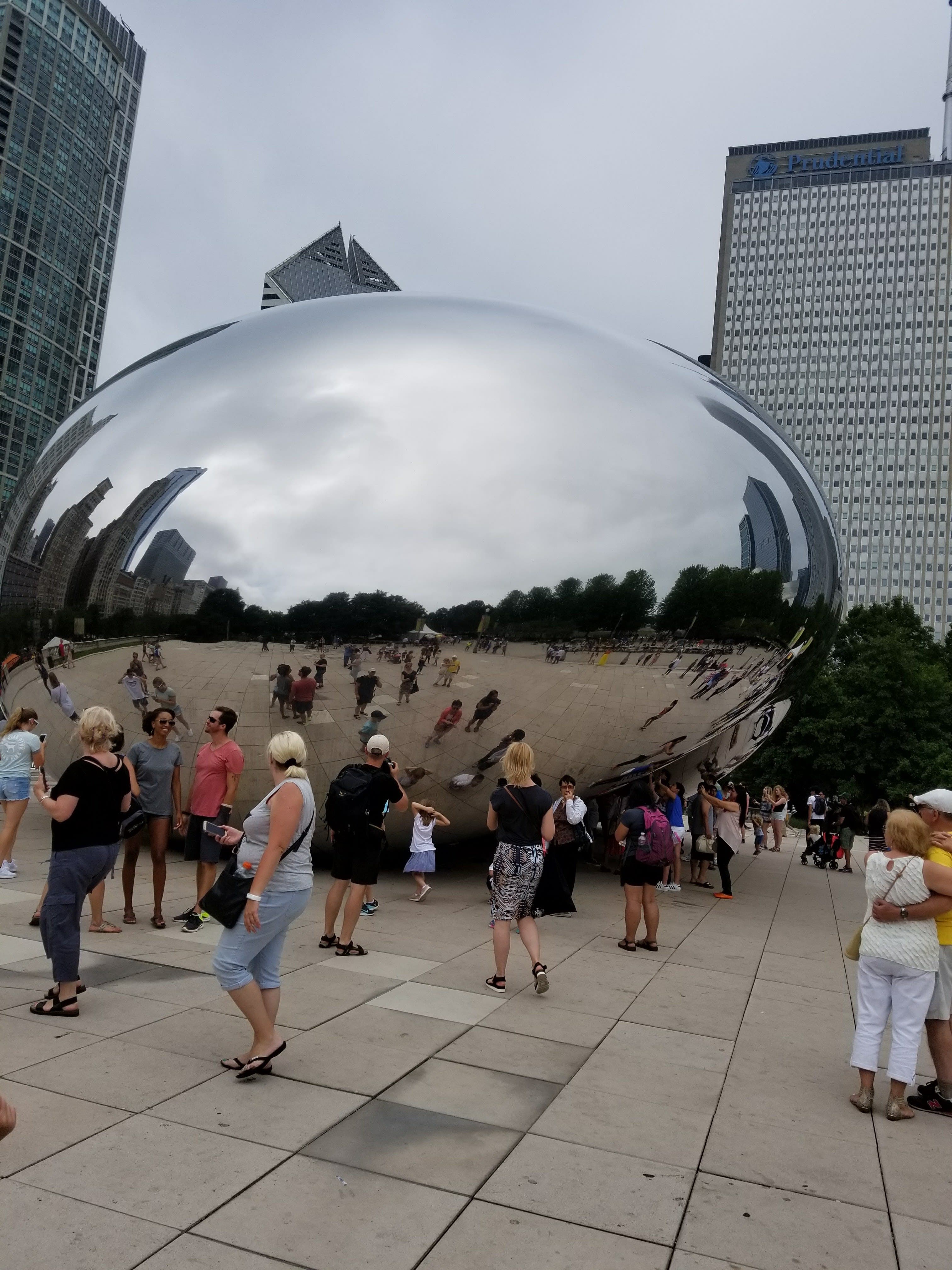 People standing by Chicago bean