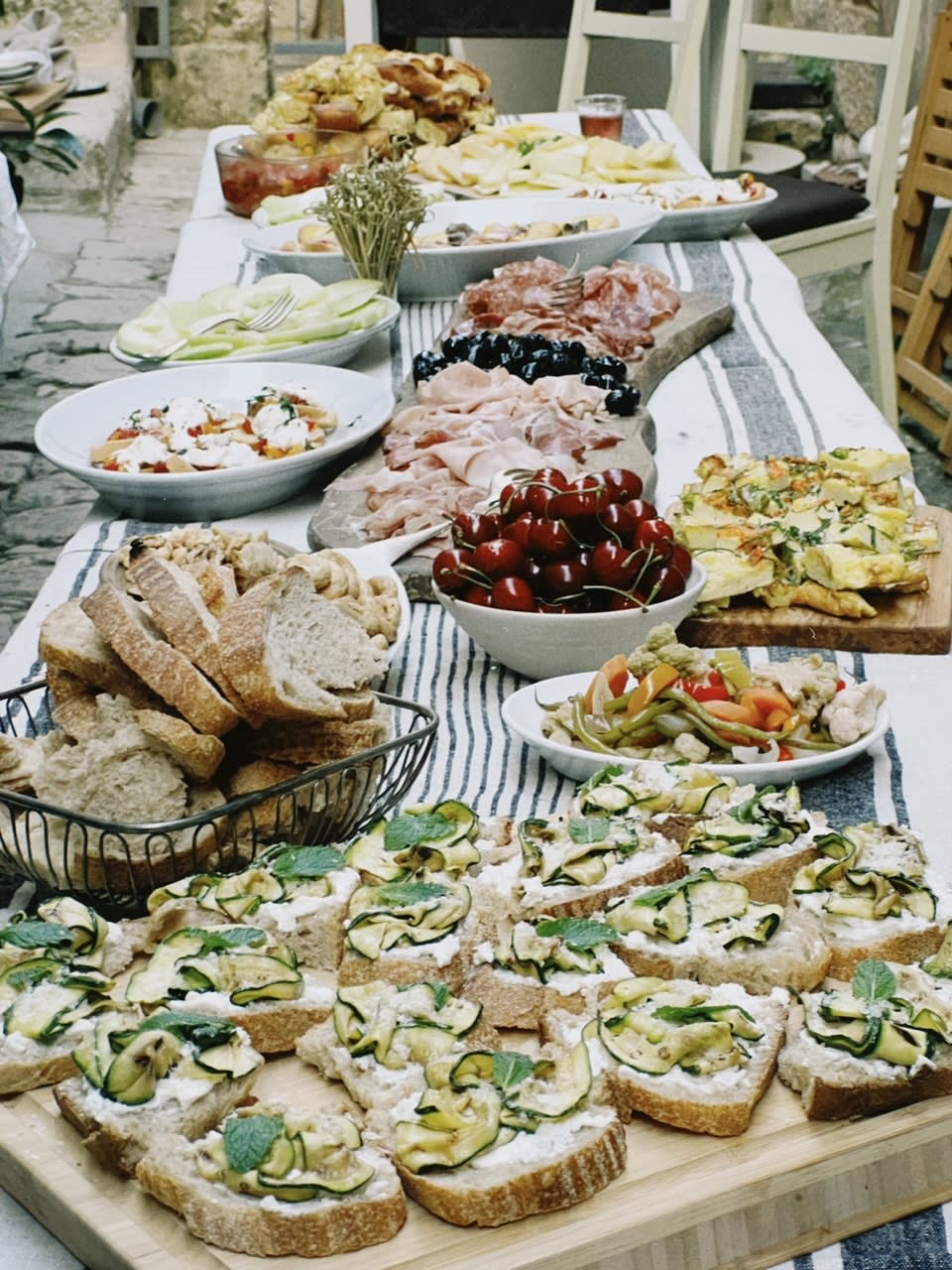 A spread of delicious food on a long table
