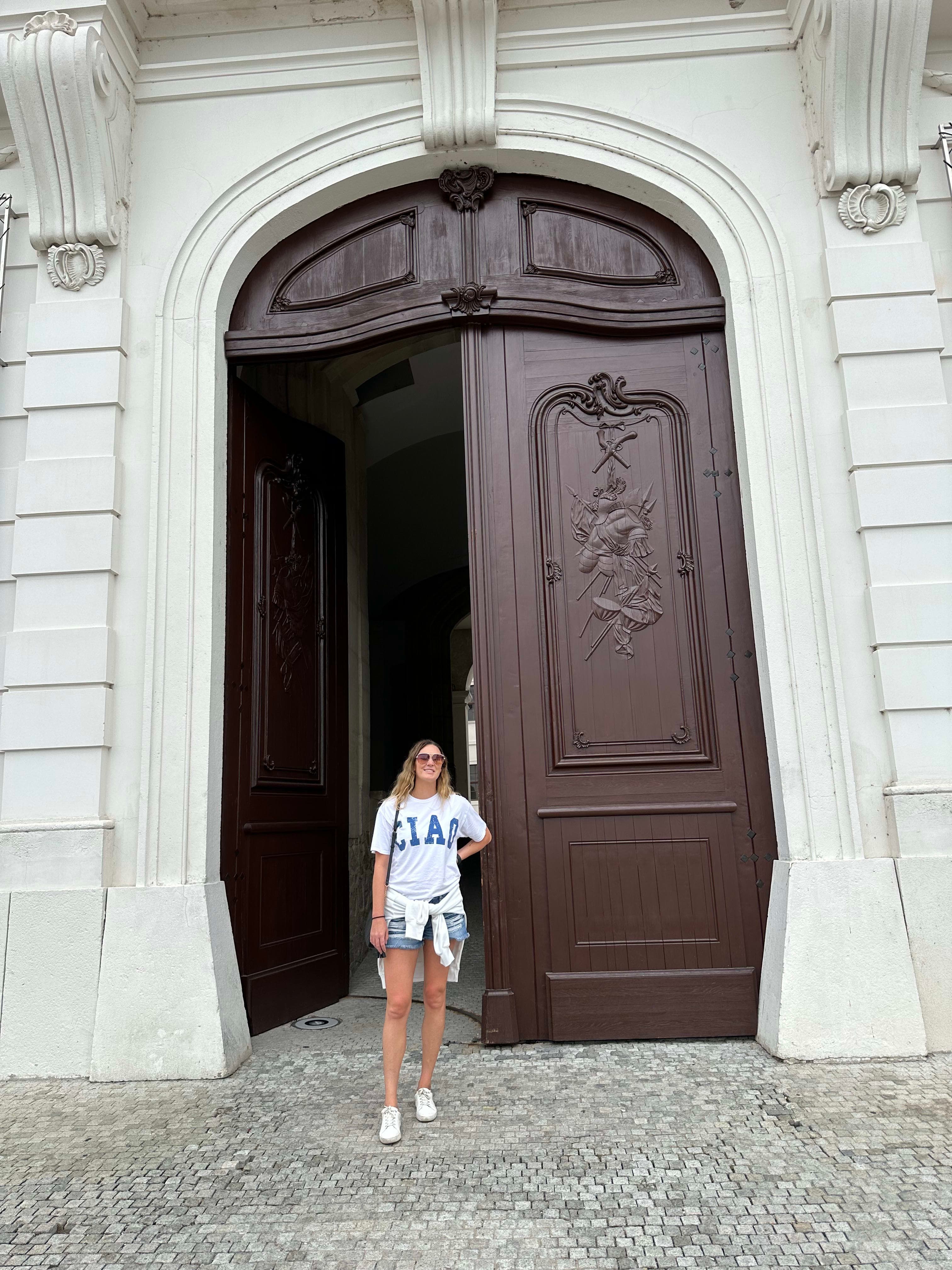 Picture of Chelby outside old wooden door