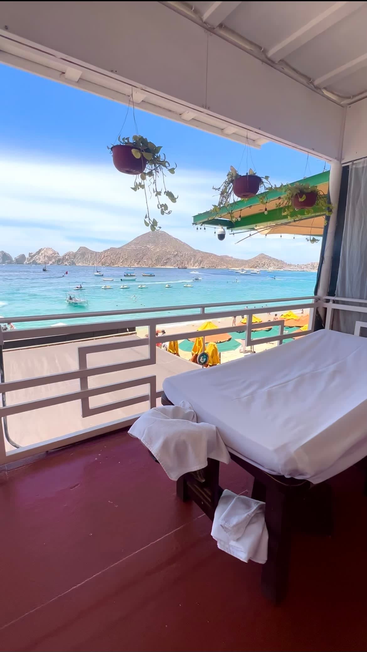Picture of a spa on the ocean with a mountains in the distance