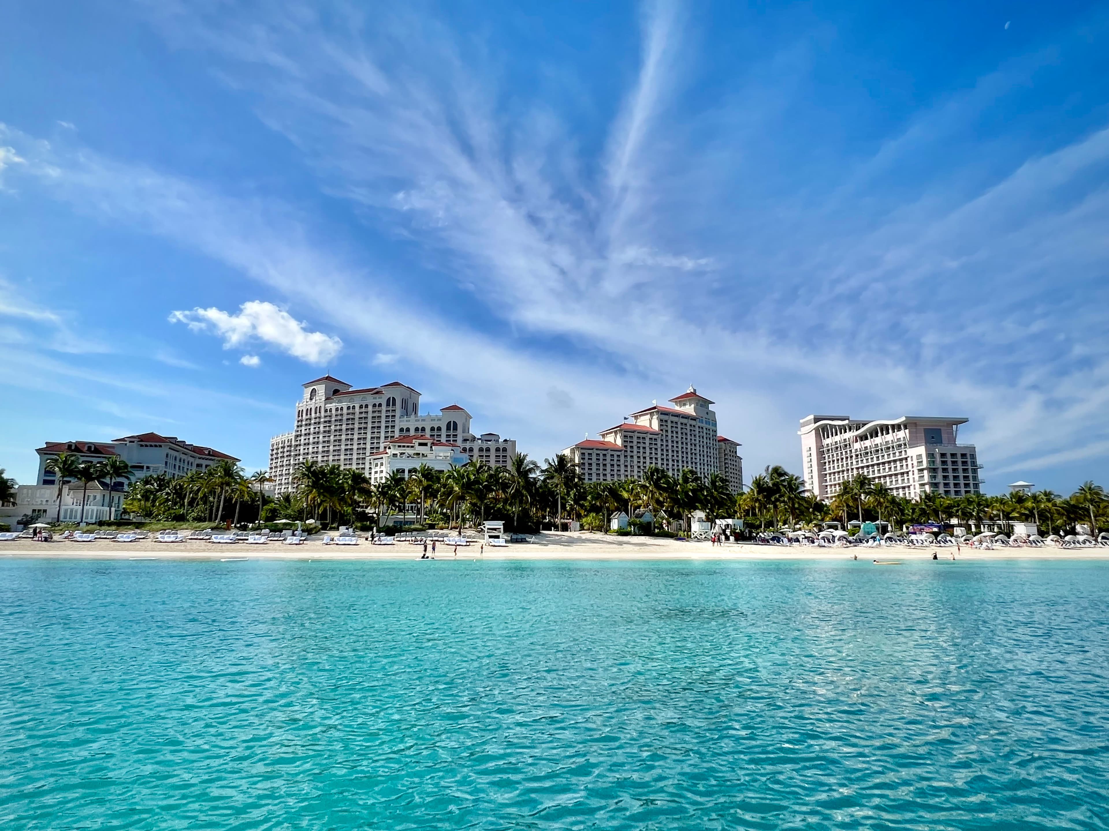 View of Baha Mar hotel from the ocean with a clear sky on a sunny day