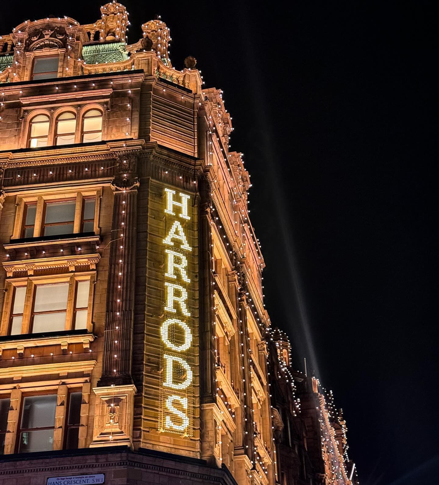 The exterior of Harrods at night