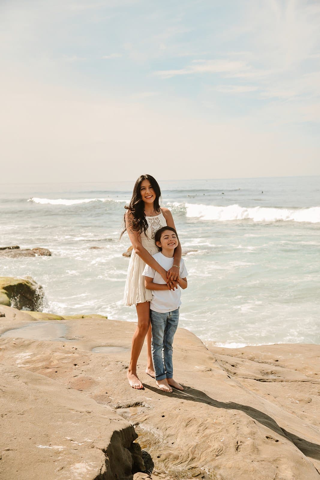 Posing for a photo on the beach with son