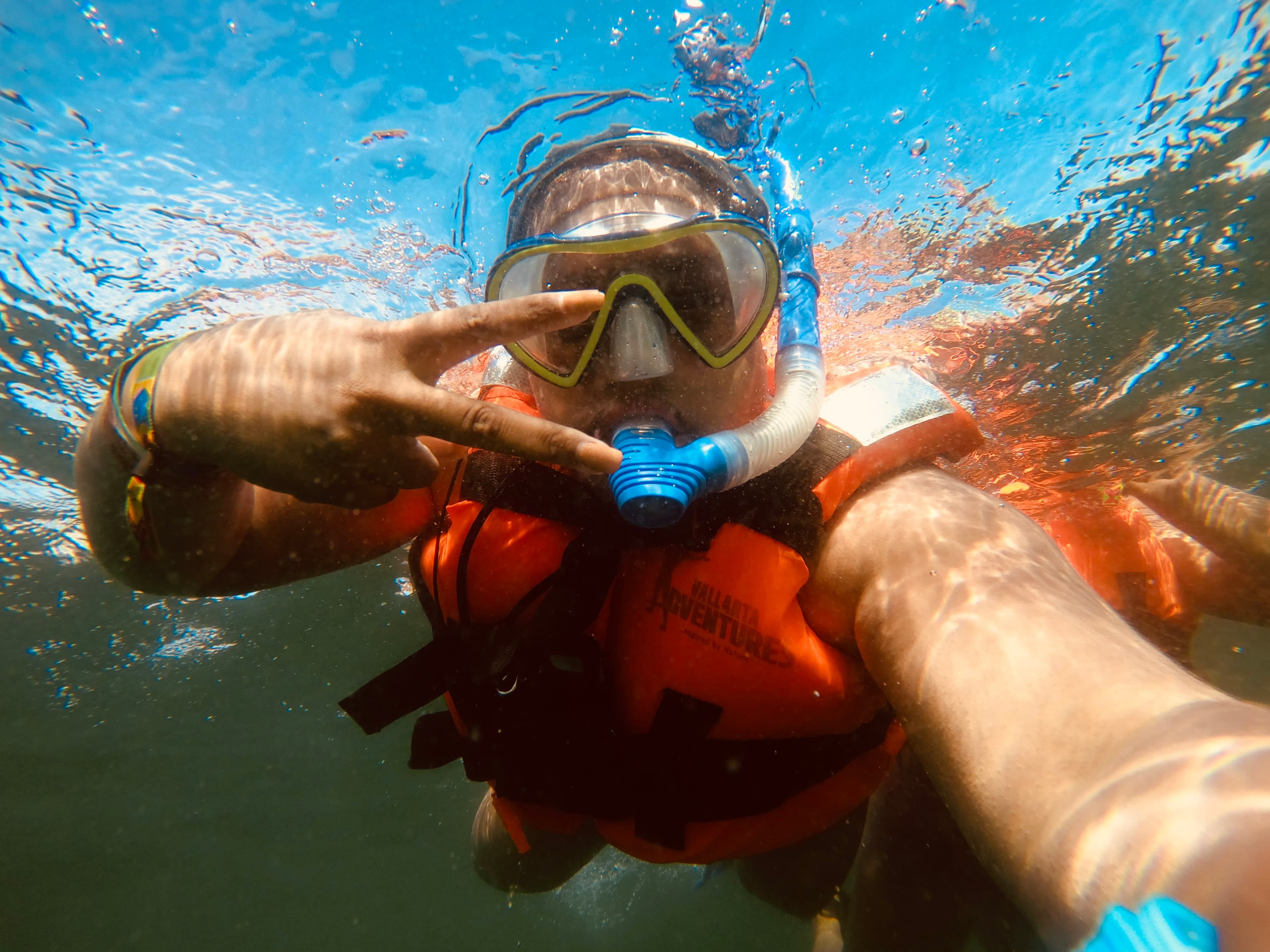 Travel advisor Antonisia taking an underwater selfie while snorkeling