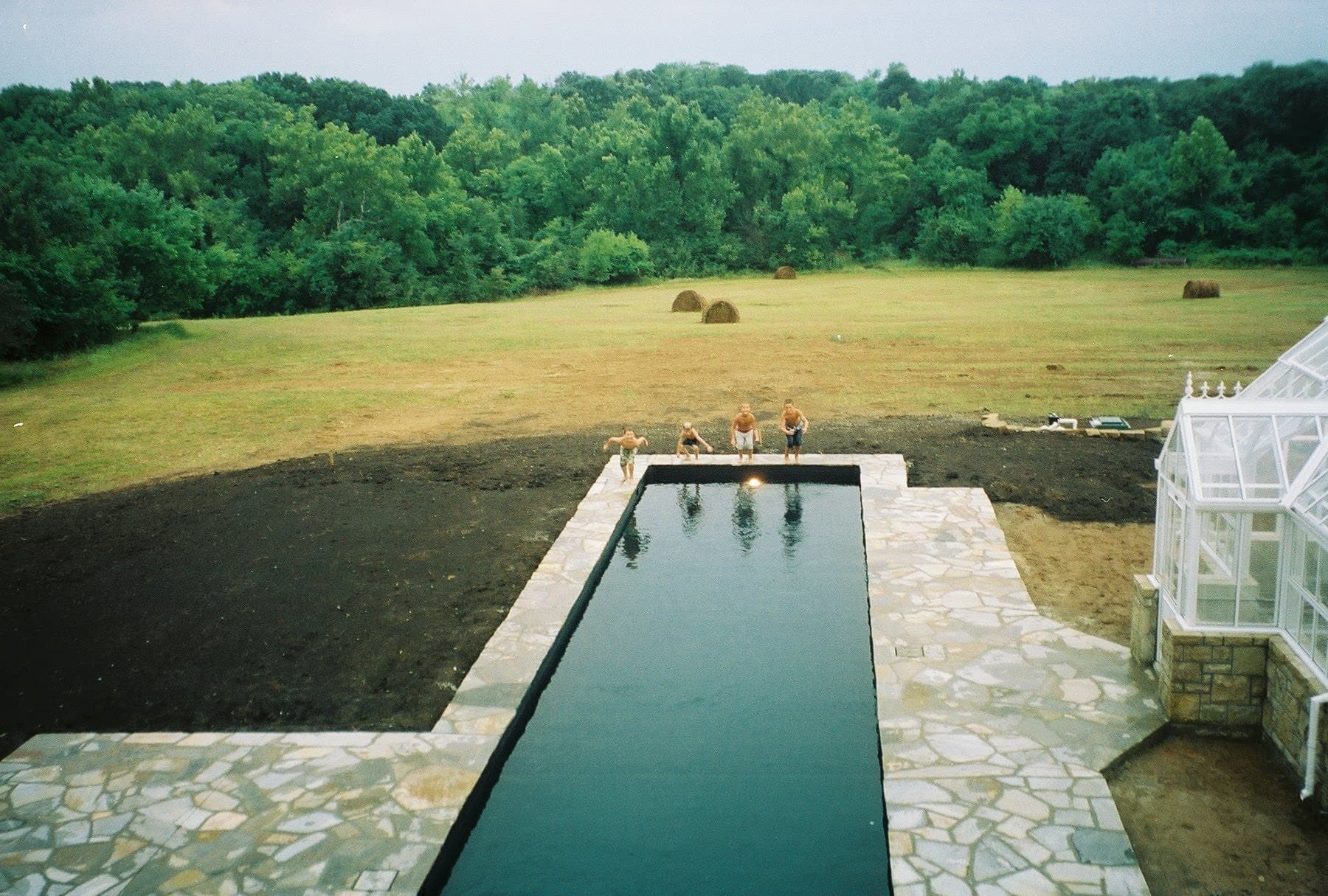 Kids jumping in the pool