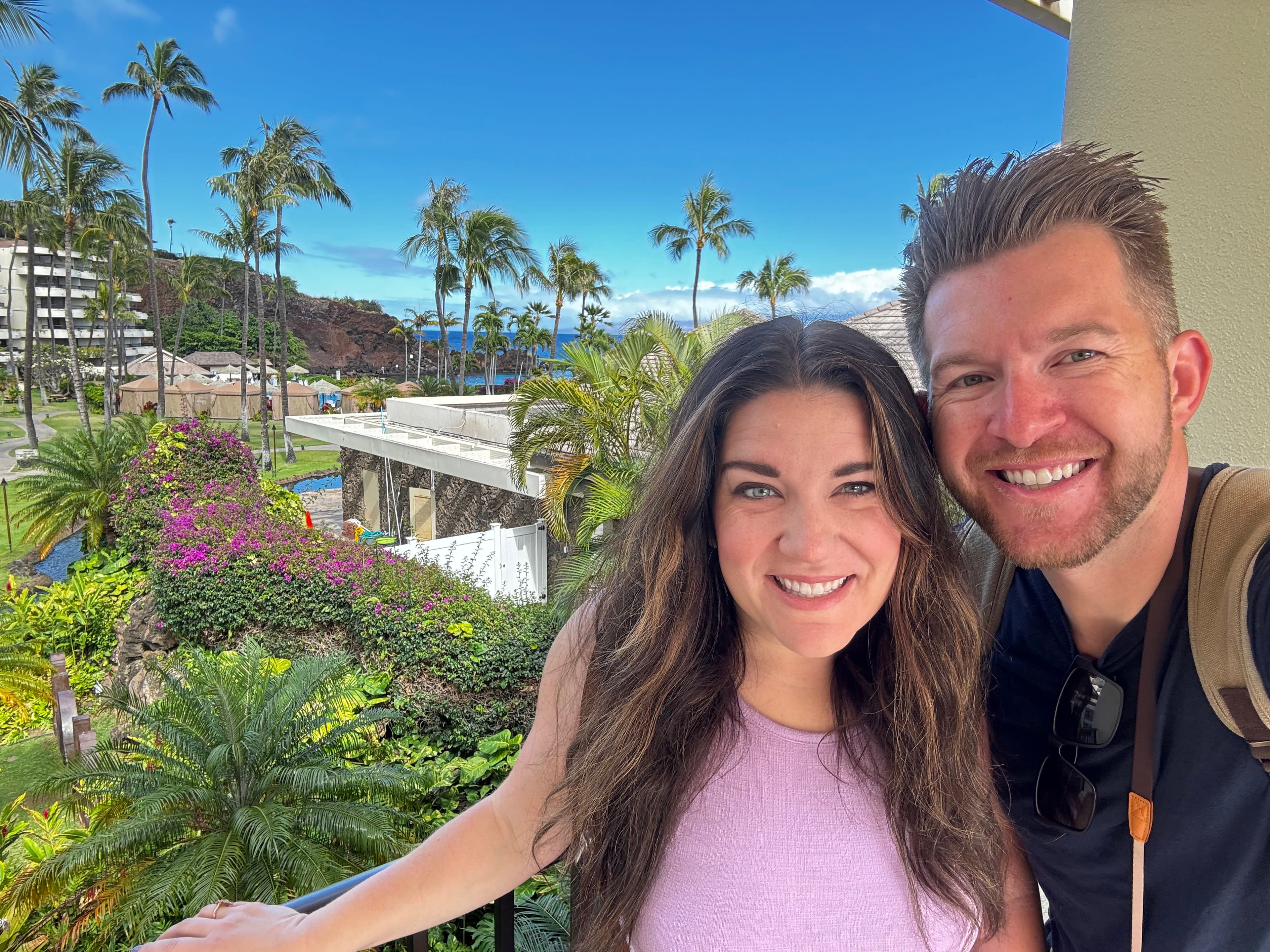 Couple photo of Cemron with trees in background