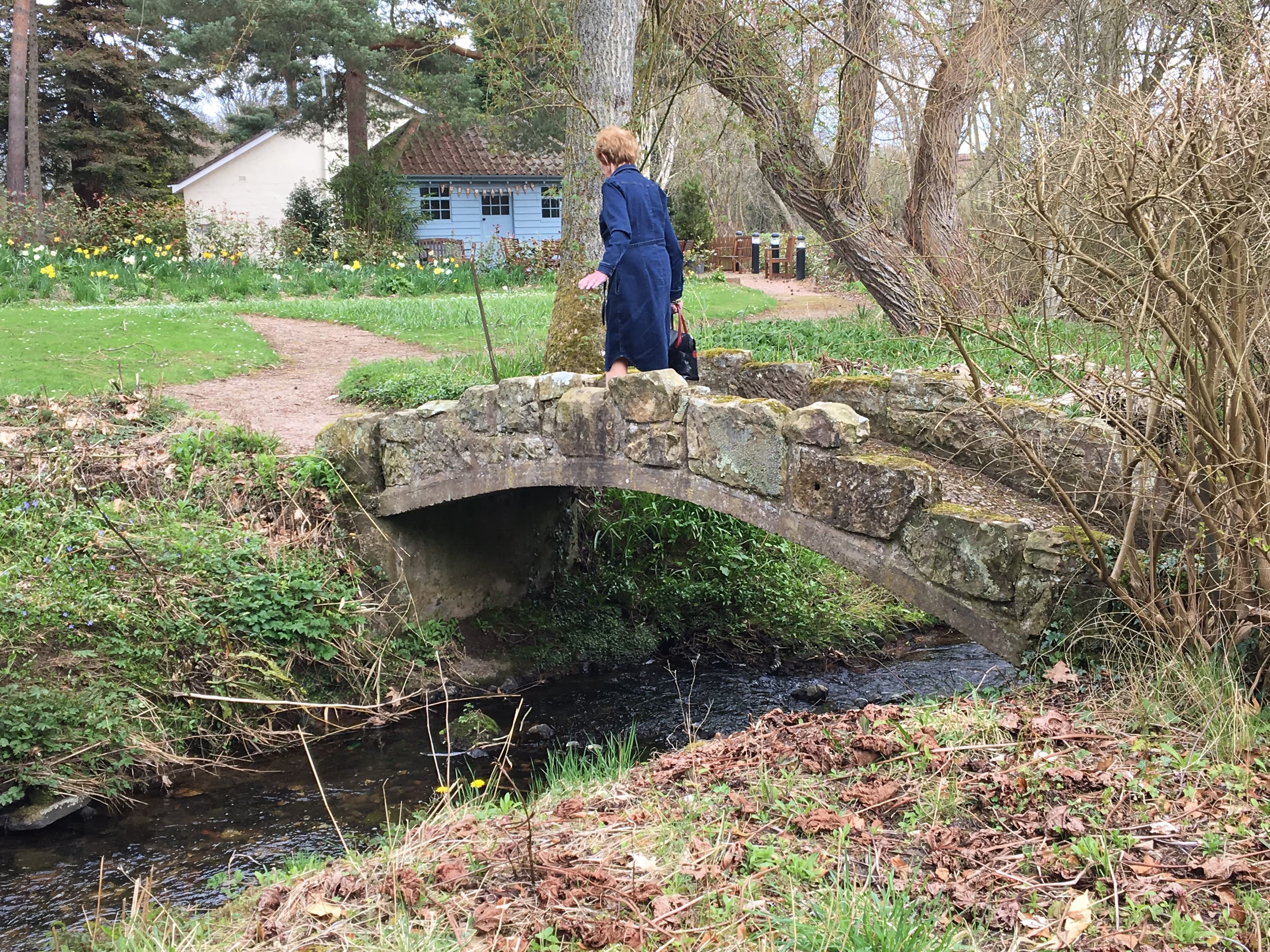 Charlotte walking across the bridge