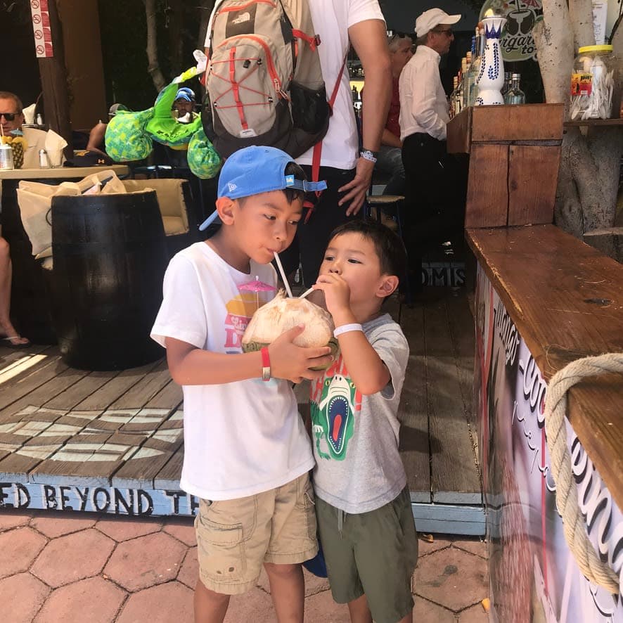 Kids drinking coconut water