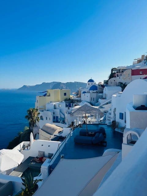 Beautiful view of Santorini white houses on cliffs overlooking a blue sea