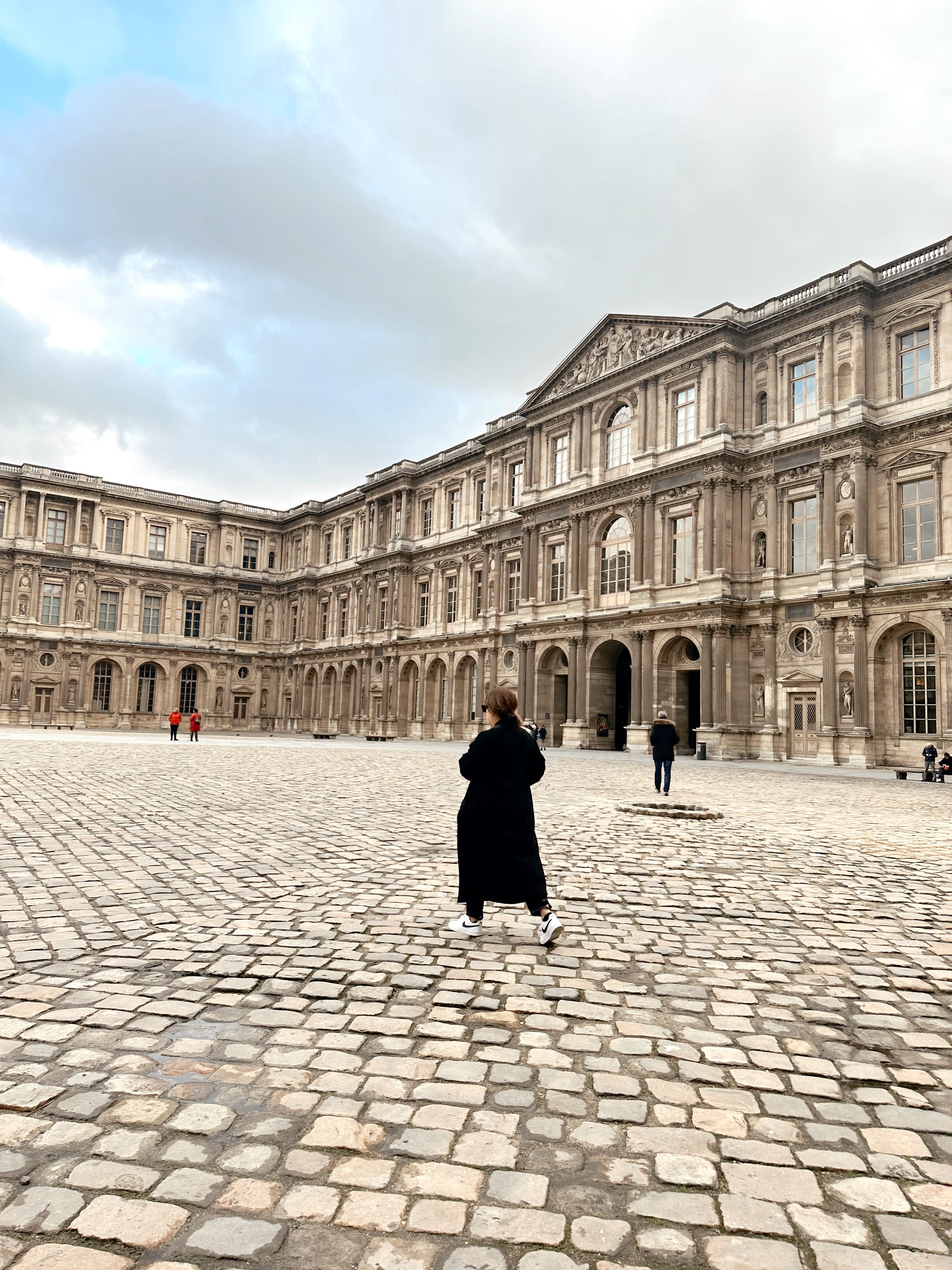 Picture of Leslie in the plaza of the Louvre Museum