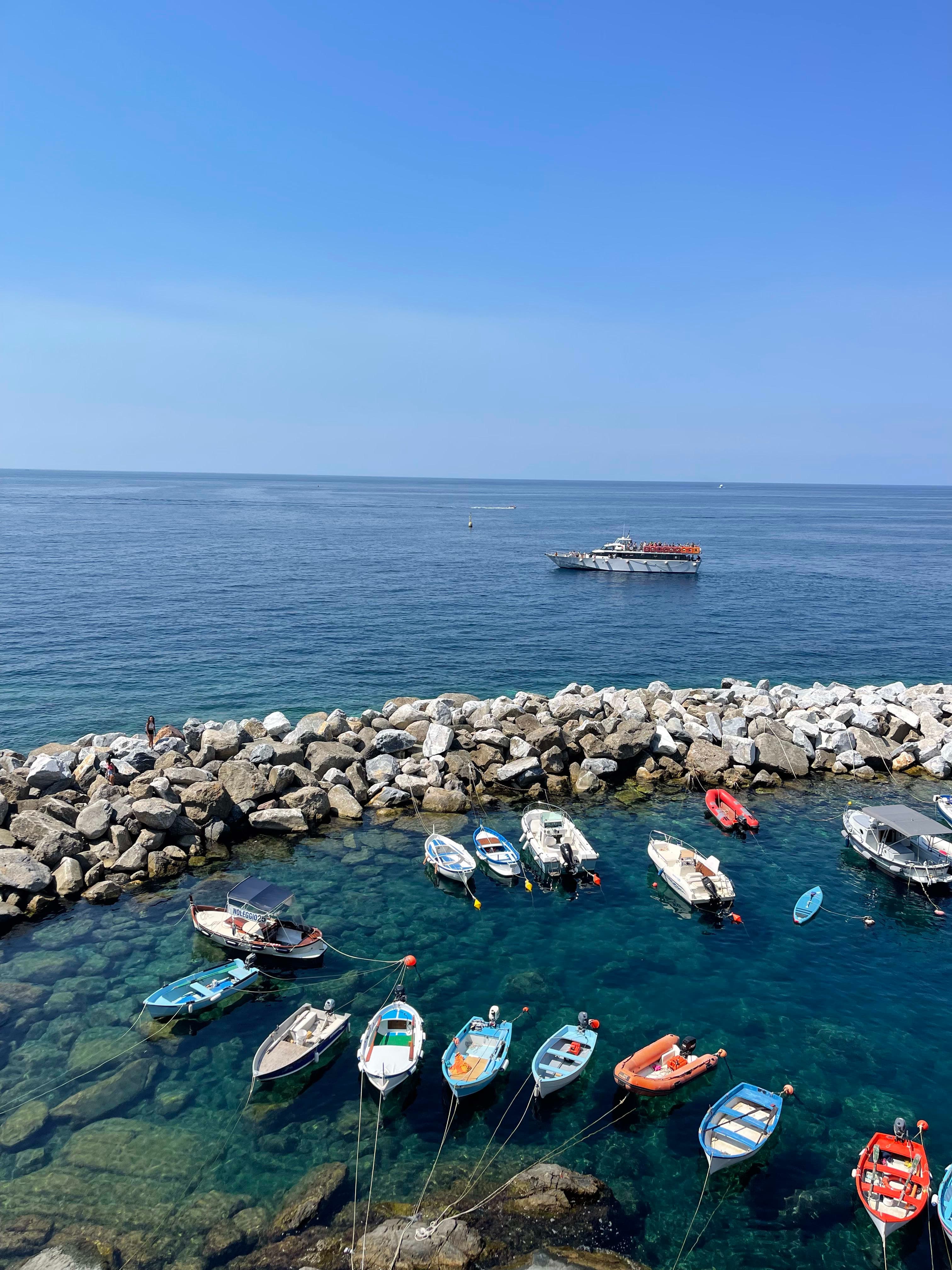 View of boats anchored near the sea shore