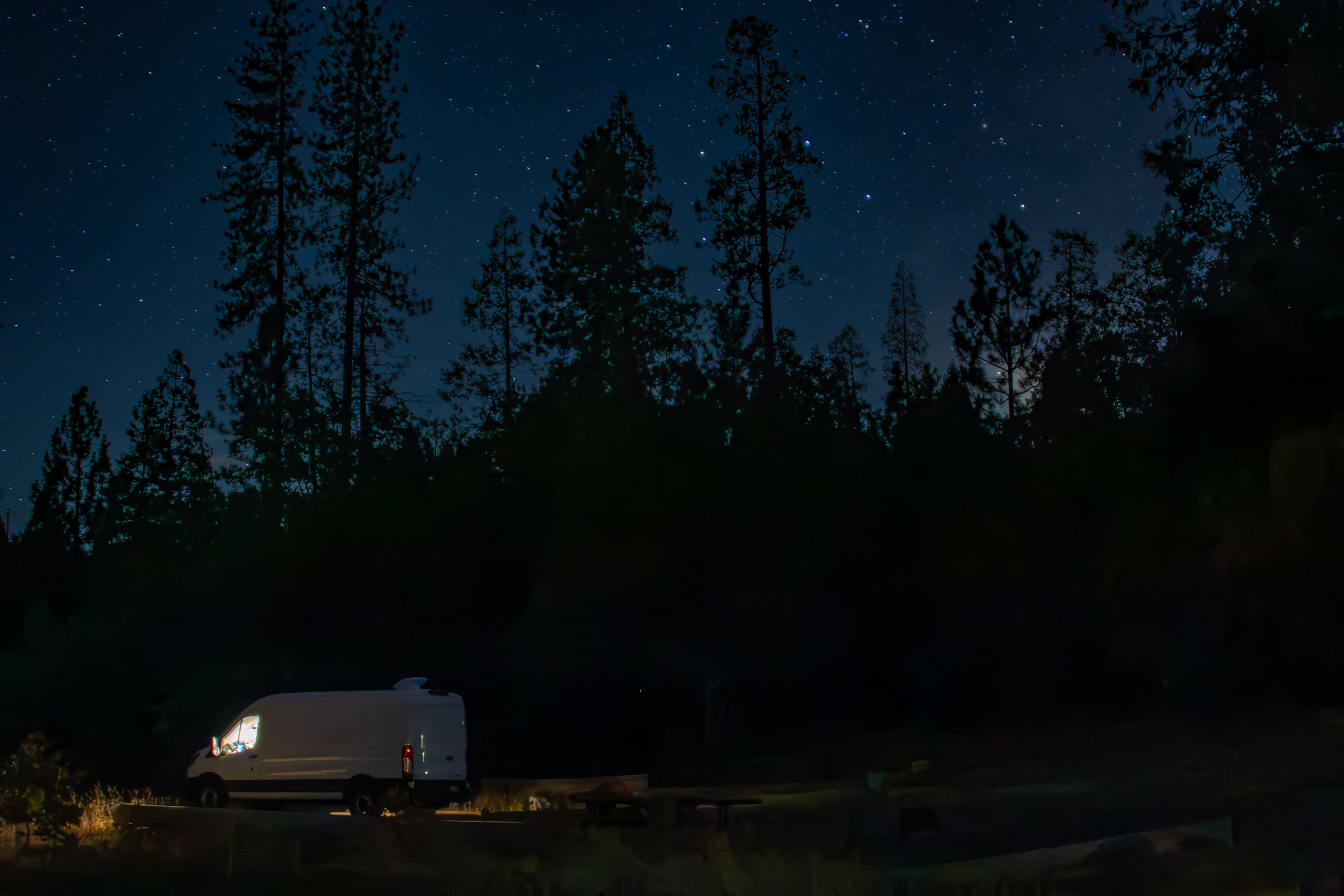 Night view of a camper parked in Yosemite National Park