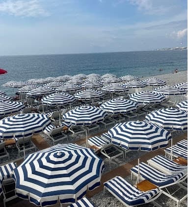 Beach lined up with black and white umbrellas