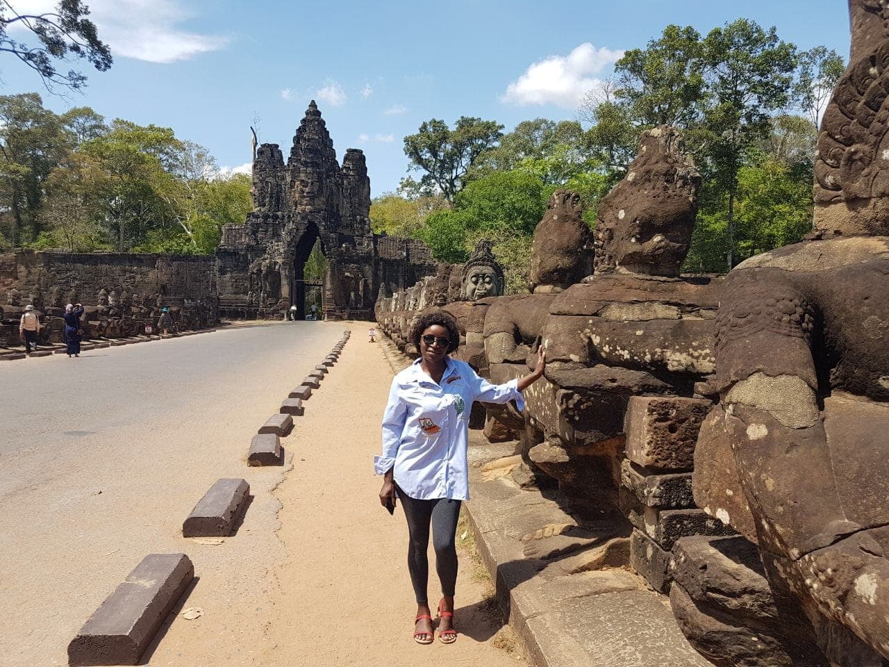 Posing for a photo at Angkor Wat temple in Cambodia