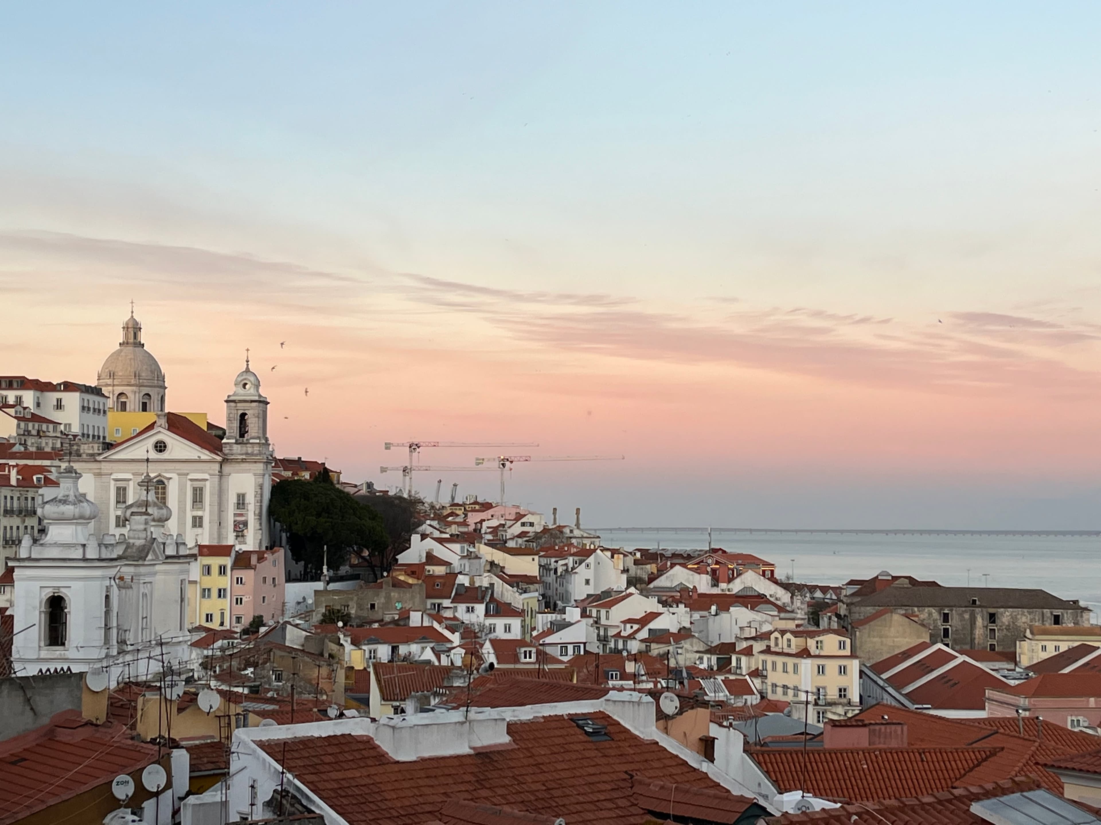 Beautiful view of rooftops in Alfama Portugal at sunset