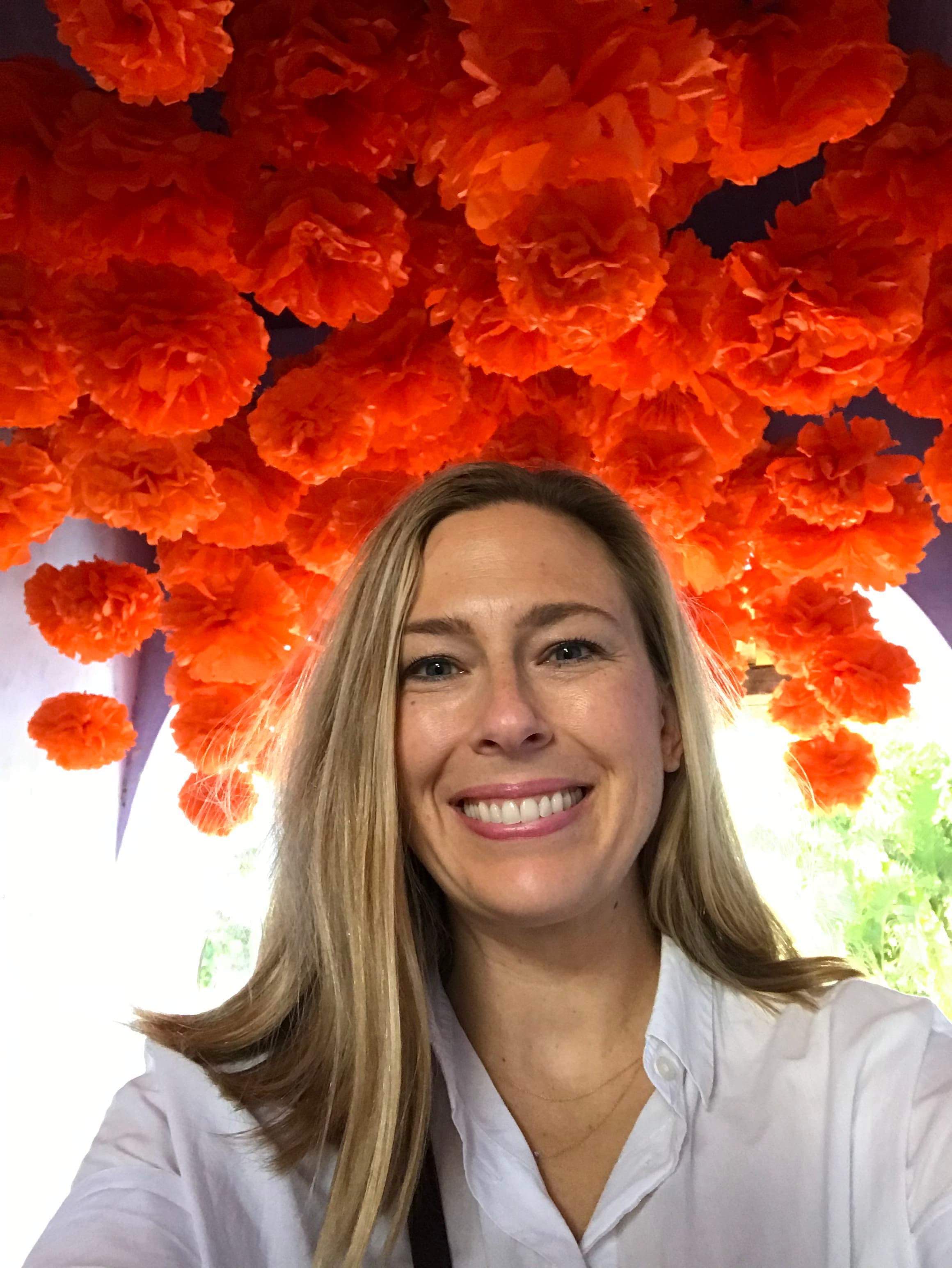 Posing for a selfie with flower decoration in view