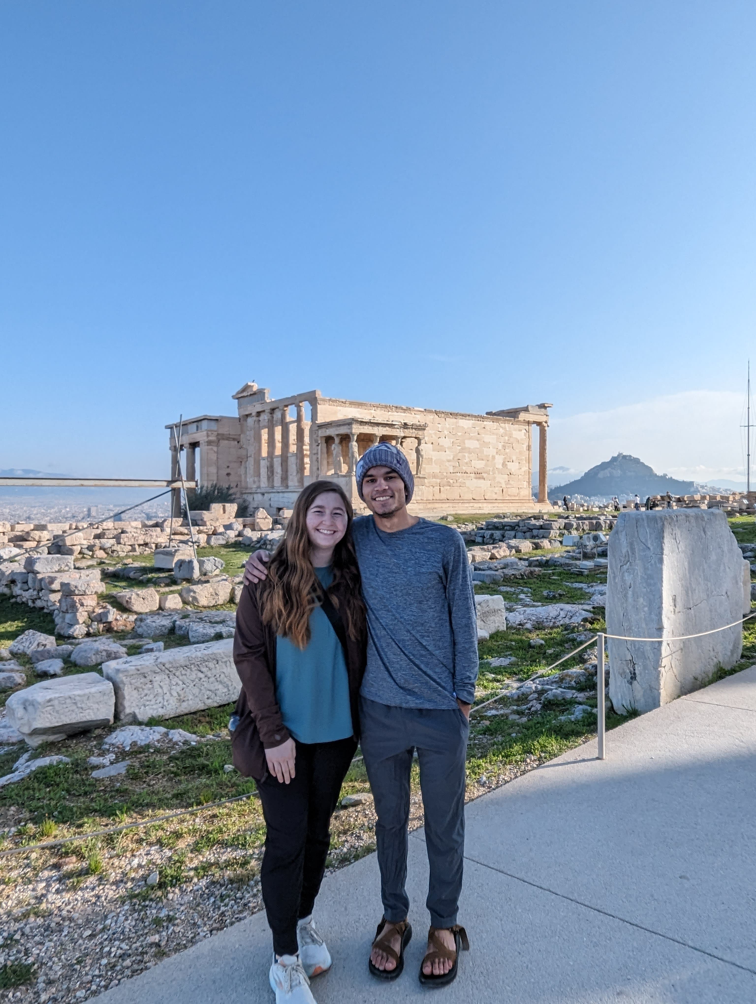 Travel advisor Jackson standing with female companion overlooking ancient archeological site