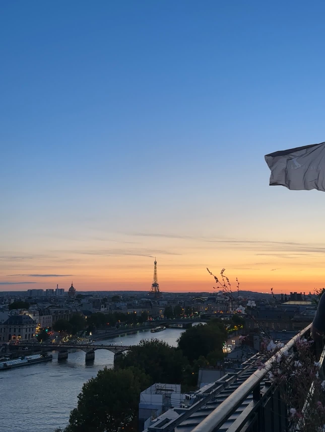 Beautiful view of the Eiffel Tower and Paris skyline at sunset